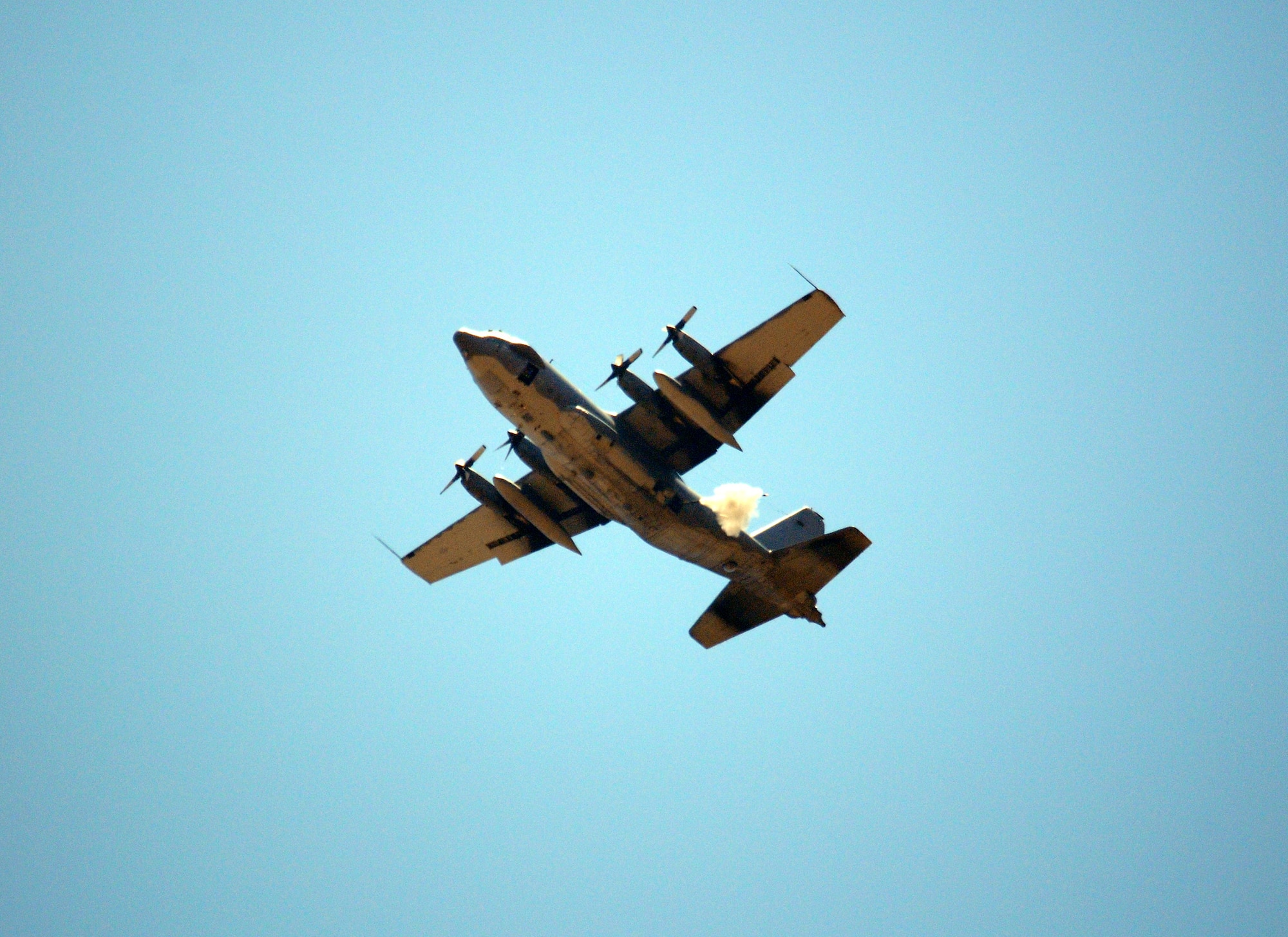 An AC-130H Spectre Gunship flown by the 16th Special Operations Squadron fires a 105 mm cannon round during the 27th Special Operations Wing Capabilities Exercise, June 4, 2011 at Melrose Air Force Range. The CAPEX is an annual aerial and ground exhibition of the 27 SOW's many special operations aircraft and missions for Cannon Airmen and their families. (U.S. Air Force photo by Staff Sgt. Nicholas Phelps)(RELEASED)