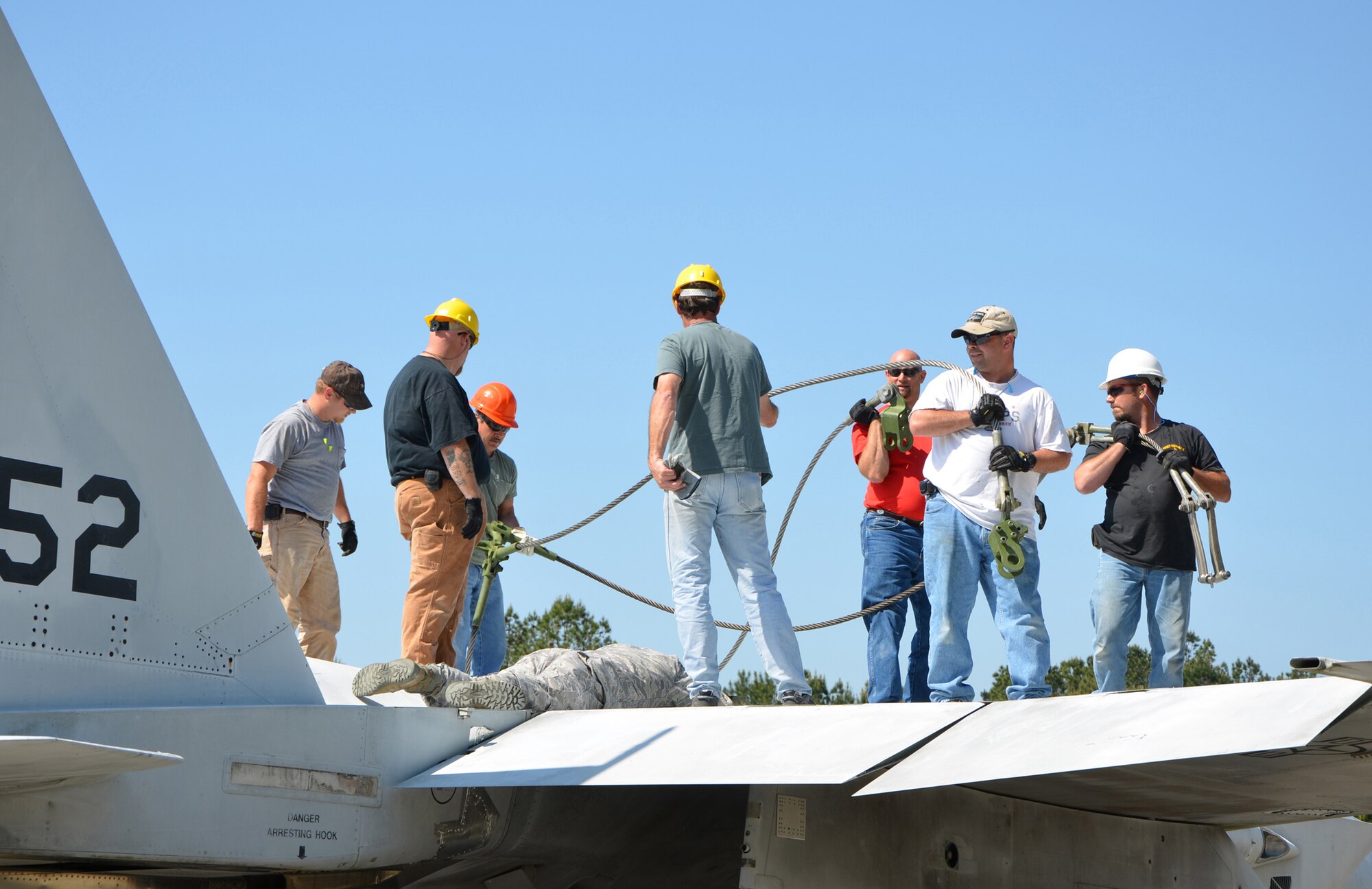 Crash Damaged or Disabled Aircraft Recovery Team members work on an F-15. Courtesy photo