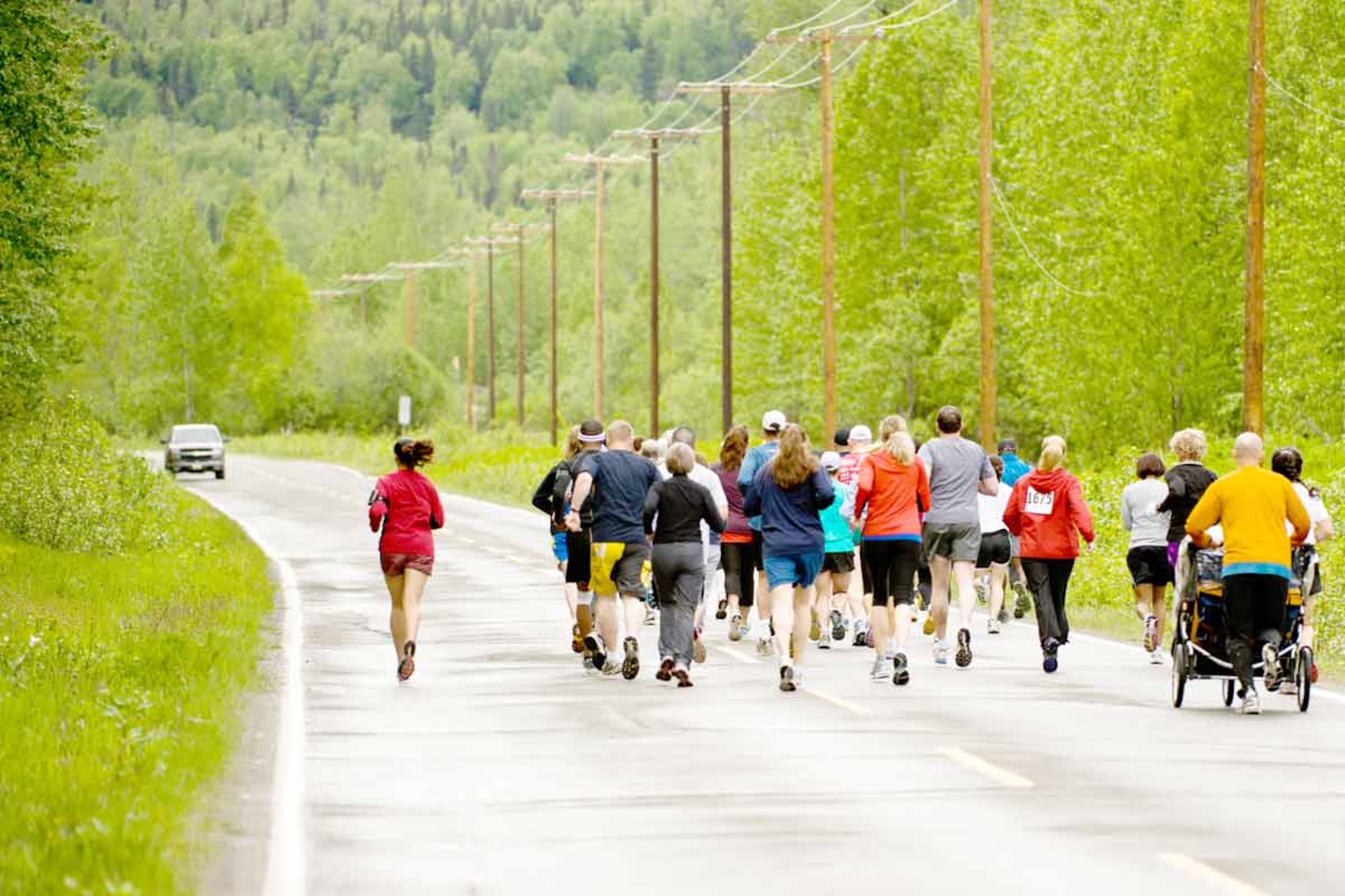 The runners take off - including a toddler whose father pushed a three-wheeled stroller all five miles.   (U.S. Air Force photos\Johnathon Green)