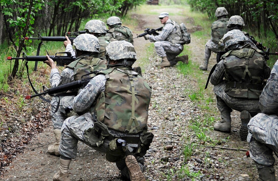 Airmen "return fire" June 2, 2011, during a dismounted patrol preparedness exercise at Eielson Air Force Base, Alaska. (U.S. Air Force photo/Airman 1st Class Laura Goodgame)