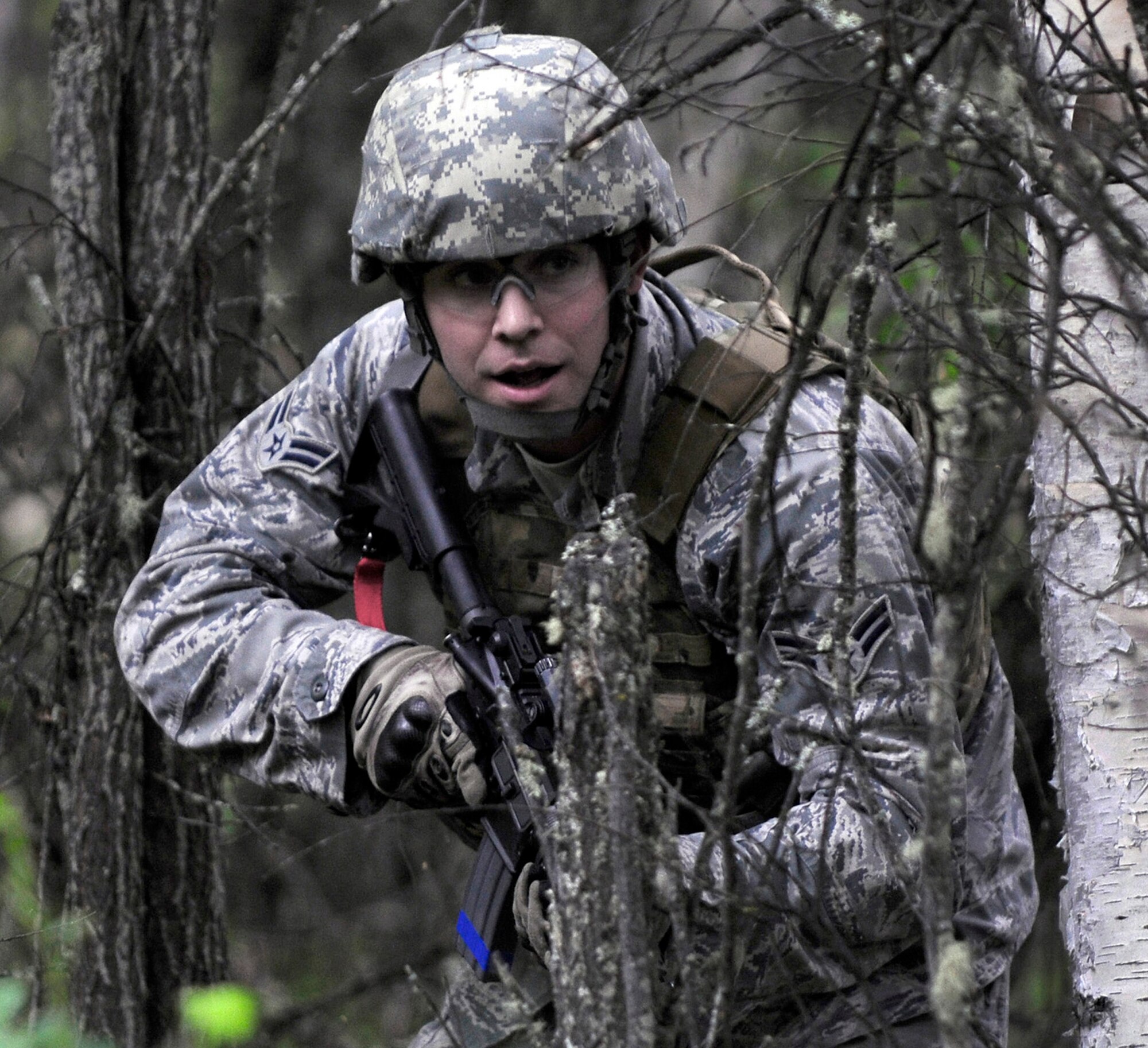 Airman 1st Class Jordan Burger prepares to "fire" his weapon June 2, 2011, during a dismounted patrol preparedness exercise at Eielson Air Force Base, Alaska. Airman Burger is assigned to the 354th Civil Engineer Squadron. (U.S. Air Force photo/Airman 1st Class Laura Goodgame)
