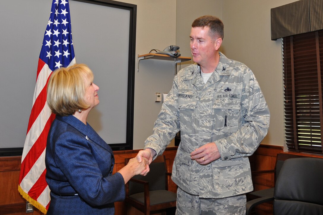 Dr. Linda Shifflette, Hampton City Schools superintendent, and Col. Donald Kirkland, 633d Air Base Wing commander, formally acknowledge the wing’s support for the local school district, at Langley Air Force Base, Va., June 7, 2011. The Adopt a School program was an idea generated through the annual Community Priority Workshop that included a forum of students, parents, military members and civic organizations. (U.S Air Force photo by Airman 1st Class Camilla Griffin/Released)