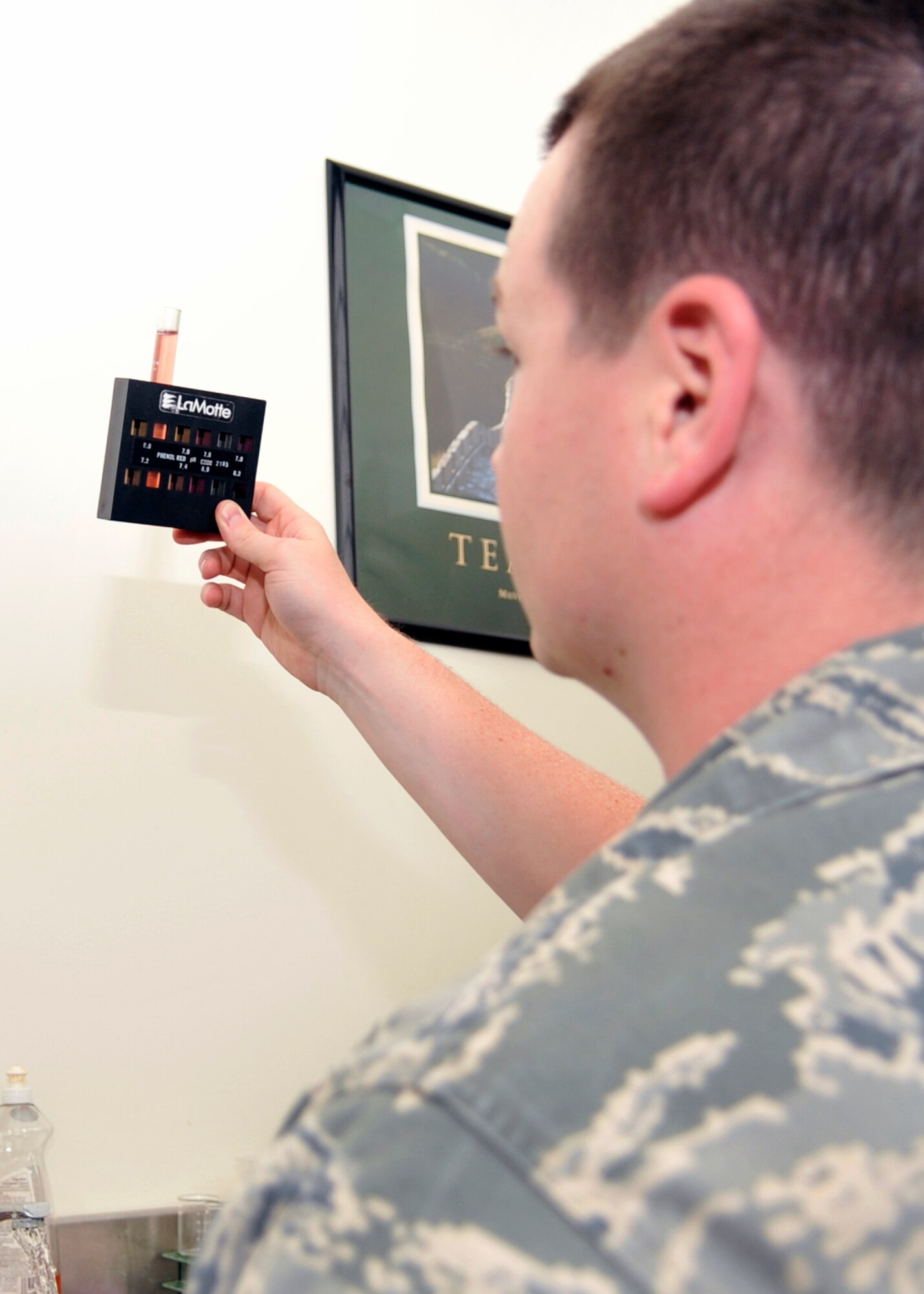 Staff Sgt. Arlen Martin, 579th Medical Operations Squadron bioenvironmental engineering technician, tests the power of Hydrogen levels in a water sample Tuesday, June 7. Imbalance of acidity or alkalinity can weaken systems in the body which makes the measuring of pH balance important in sampling pool or drinking water on the base. (U.S. Air Force photo/Senior Airman Laura Turner)