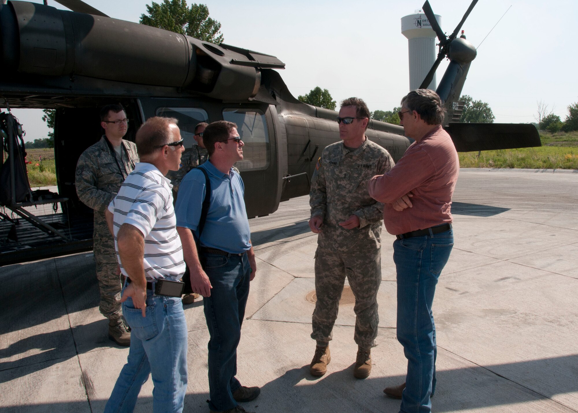 Chief Warrant Officer Christian Franks (Center), South Dakota’s Army Aviation Safety Officer,  briefs (from left) Rick Wagner, from Wagner Construction, Tim Brown, from Brown Construction, and South Dakota’s Secretary of Agriculture Walt Bones, prior to taking a aerial tour of the Missouri river flood zone, on June 8, 2011.  Bones, Wagner and Brown assessed the current damages and the potential threats caused by the increasing Missouri river flood levels.
Air Force Photo by: Tech. Sgt. Oscar Sanchez
