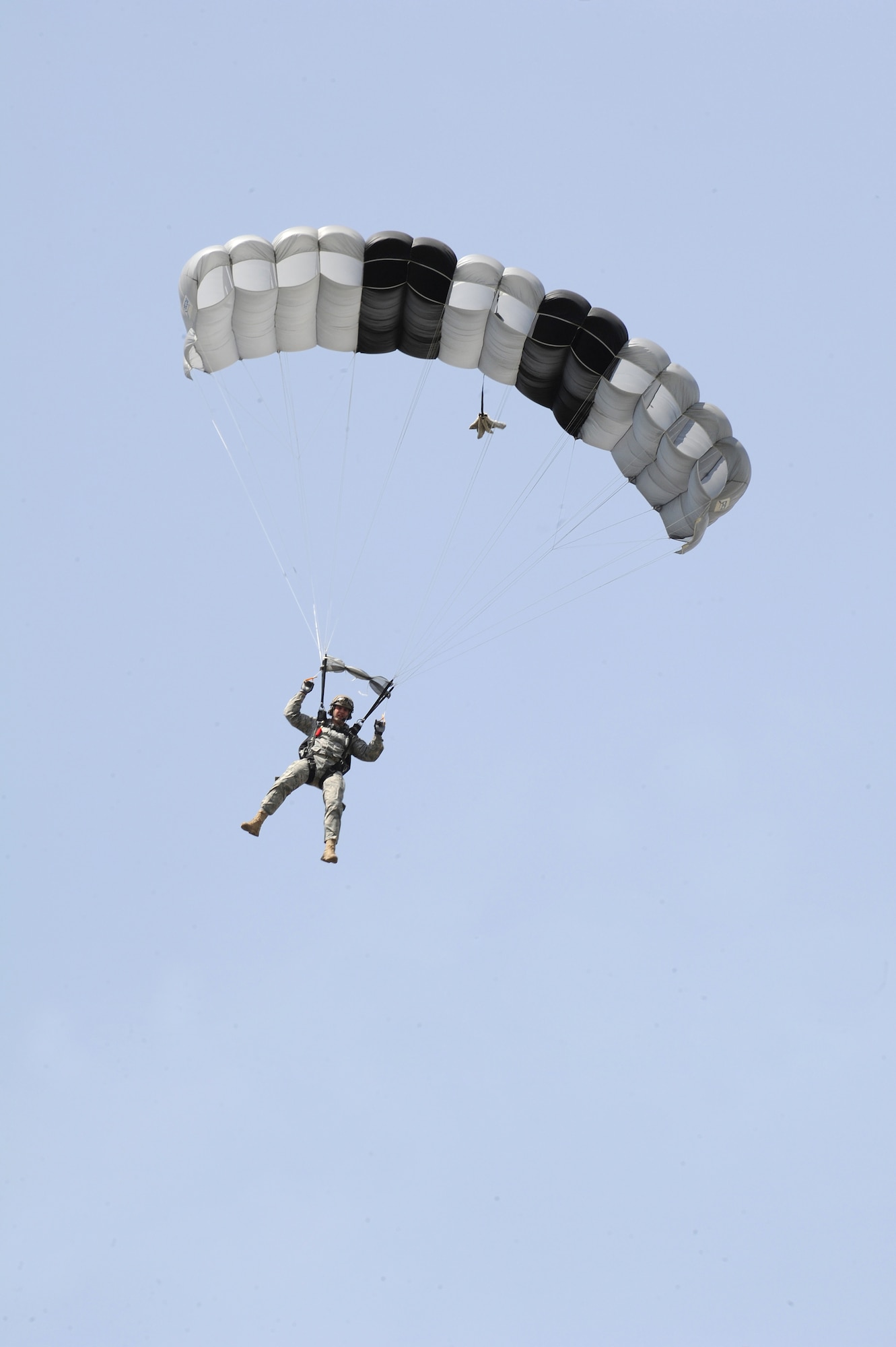 Master Sgt. James Wright, 66th Training Support Squadron, prepares to land during a parachute demonstration using a Javelin non-standard parachute. Sgt. Wright jumped from a UH-1N Huey helicopter during weekly training at Fairchild AFB, Wash., May 13, 2011. (U.S. Air Force Photo/Tech Sgt. JT May III)