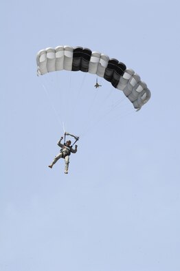 Master Sgt. James Wright, 66th Training Support Squadron, prepares to land during a parachute demonstration using a Javelin non-standard parachute after jumping from a UH-1N Huey helicopter during weekly training at Fairchild Air Force Base, Wash., on May 13, 2011. (U.S. Air Force Photo/Tech Sgt. J.T. May III)