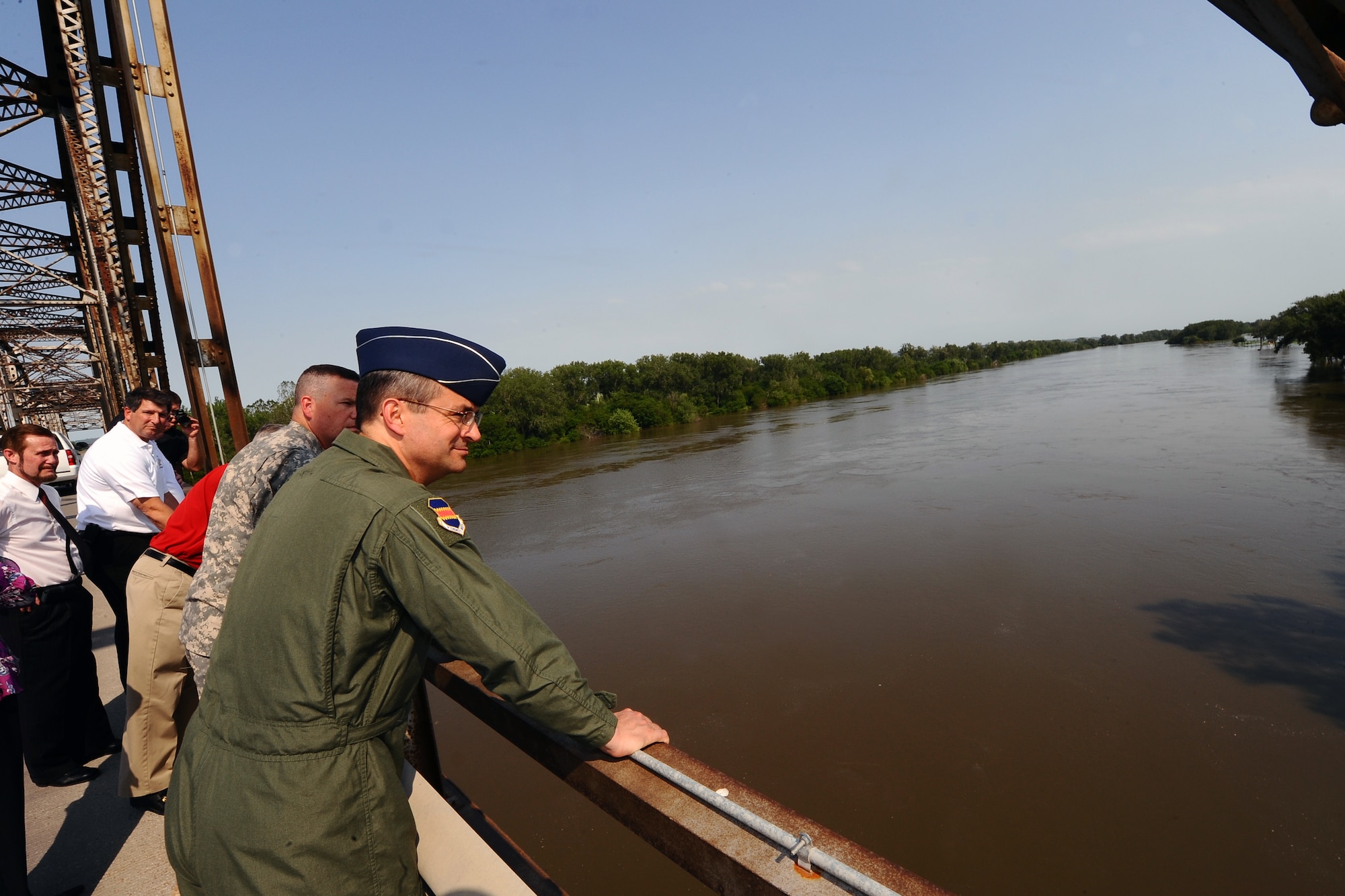 OFFUTT AIR FORCE BASE, Neb.- Brig. Gen. Donald Bacon, 55th Wing commander, stands on the Bellevue Bridge overlooking the Missouri River as it slowly inches toward Bellevue June 8.  Preparation for the increased water levels from the Missouri River is crucial in how Offutt adapts to its continuing mission despite the record water flow.  U.S. Air Force Photo by Josh Plueger.