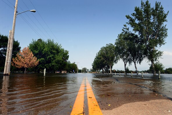 Water continues to engulf Haworth Park in Bellevue, Neb., with the promise of a significant increase in water. The water is projected to crest a mere two feet from the top of the adjacent levees in the city. Preparation for the increased water levels from the Missouri River is crucial to how Offutt adapts to continuing its mission despite the record water flow. (U.S. Air Force photo by Josh Plueger/Released). 

