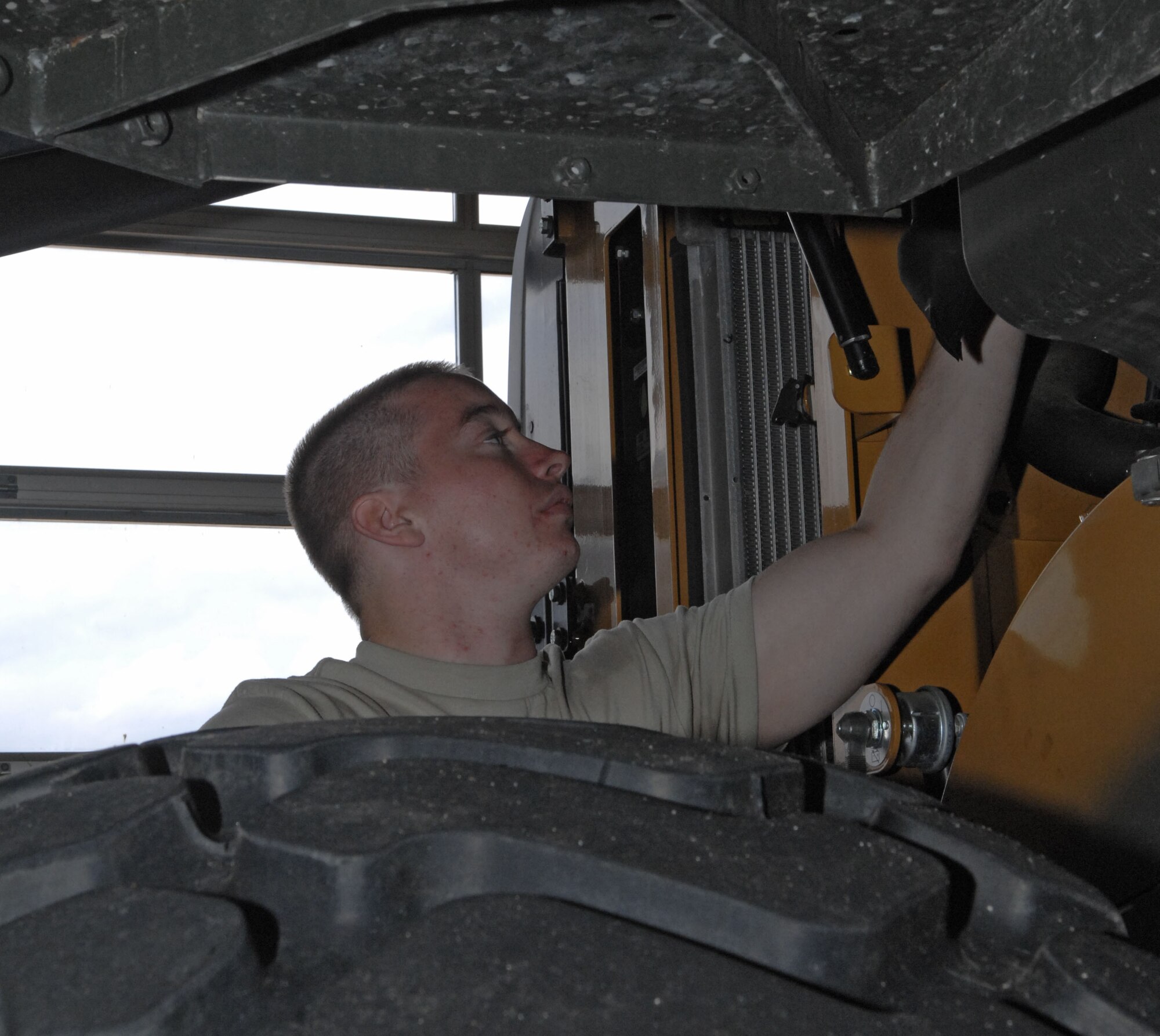 SPANGDAHLEM AIR BASE, Germany – Airman 1st Class Brandon Conner, 52nd Logistics Readiness Squadron vehicle maintenance apprentice, performs a function check after working on a tracker here June 8. The vehicle maintenance flight fixes and inspects heavy equipment in need of maintenance and repair. (U.S. Air Force photo/Airman 1st Class Matthew B. Fredericks)