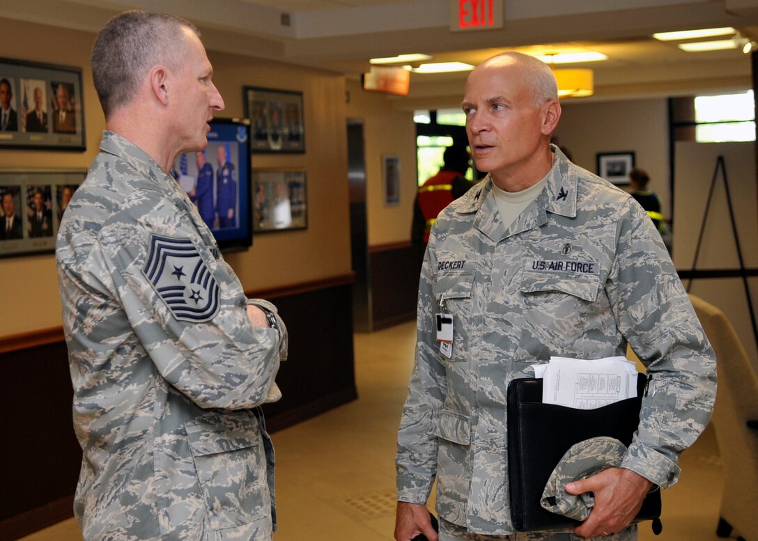 Chief Master Sgt. Roddy Hartsook, 79th Medical Wing command chief, and Col. Brian Deckert, 779th Medical Group deputy commander, discuss procedures during an exercise Thursday, June 9. The exercise took place as part of the Unit Compliance Inspection at Joint Base Andrews. (U.S. Air Force photo/Senior Airman Laura Turner)