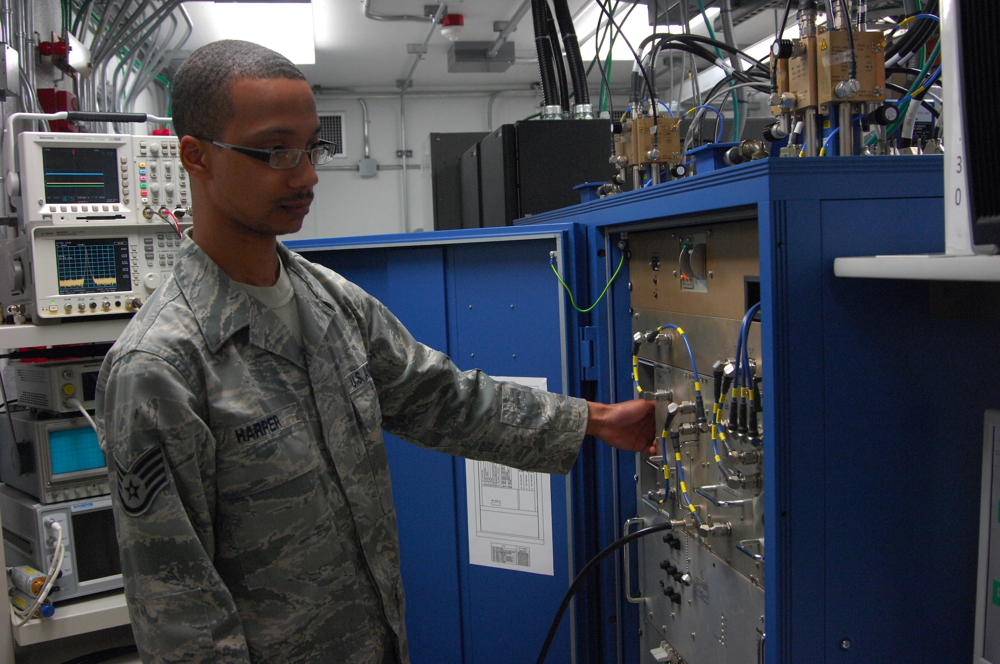 ROYAL AIR FORCE LAKENHEATH, England--Staff Sgt. Marcus Harper, 48th Communication Squadron radar maintence journeyman, checks radar equipment on June 8, 2011. Sergeant Harper was nominated for a Liberty Spottlight because he displays the core value of 'Excellence in All We Do'. (U.S. Air Force photo/Senior Airman Eboni Reams)