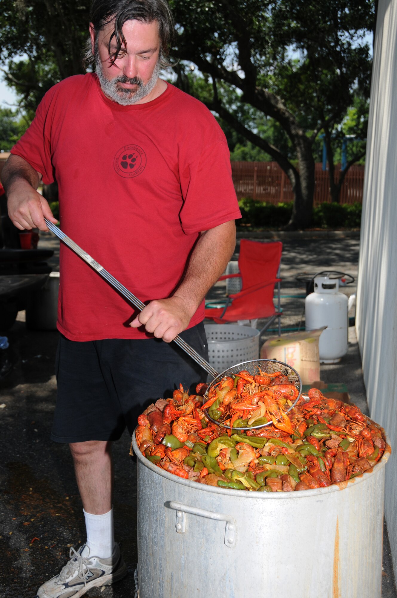 Brent Misita, 336th TRS cyber operations instructor, boils a pot of crawfish for his squadron’s get-together. The summer months are popular times for squadron picnics, even with south Mississippi’s steamy temperatures.  (U.S. Air Force photo by Kemberly Groue)