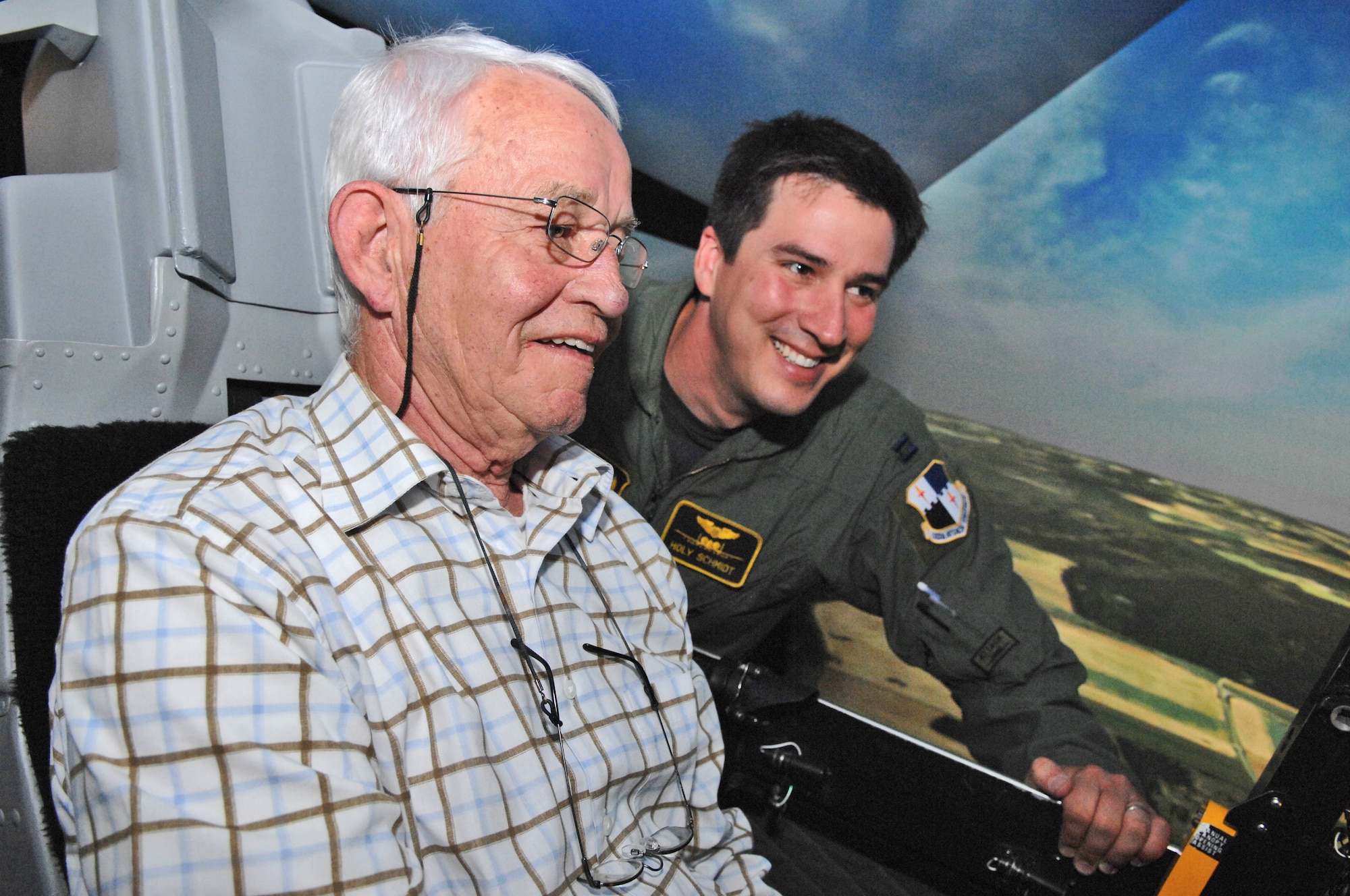 SPANGDAHLEM AIR BASE, Germany – Capt. James Schmidt, 81st Fighter Squadron A-10 Thunderbolt II pilot, talks with Luxemburg 385th Bomb Group Museum director, Roger Feller, as he uses an A-10 flight simulator here June 8. Civic leaders from the region around Spangdahlem Air Base visited the base to familiarize themselves with how the 52nd Fighter Wing operates. (U.S. Air Force photo/Airman 1st Class Matthew B. Fredericks)
