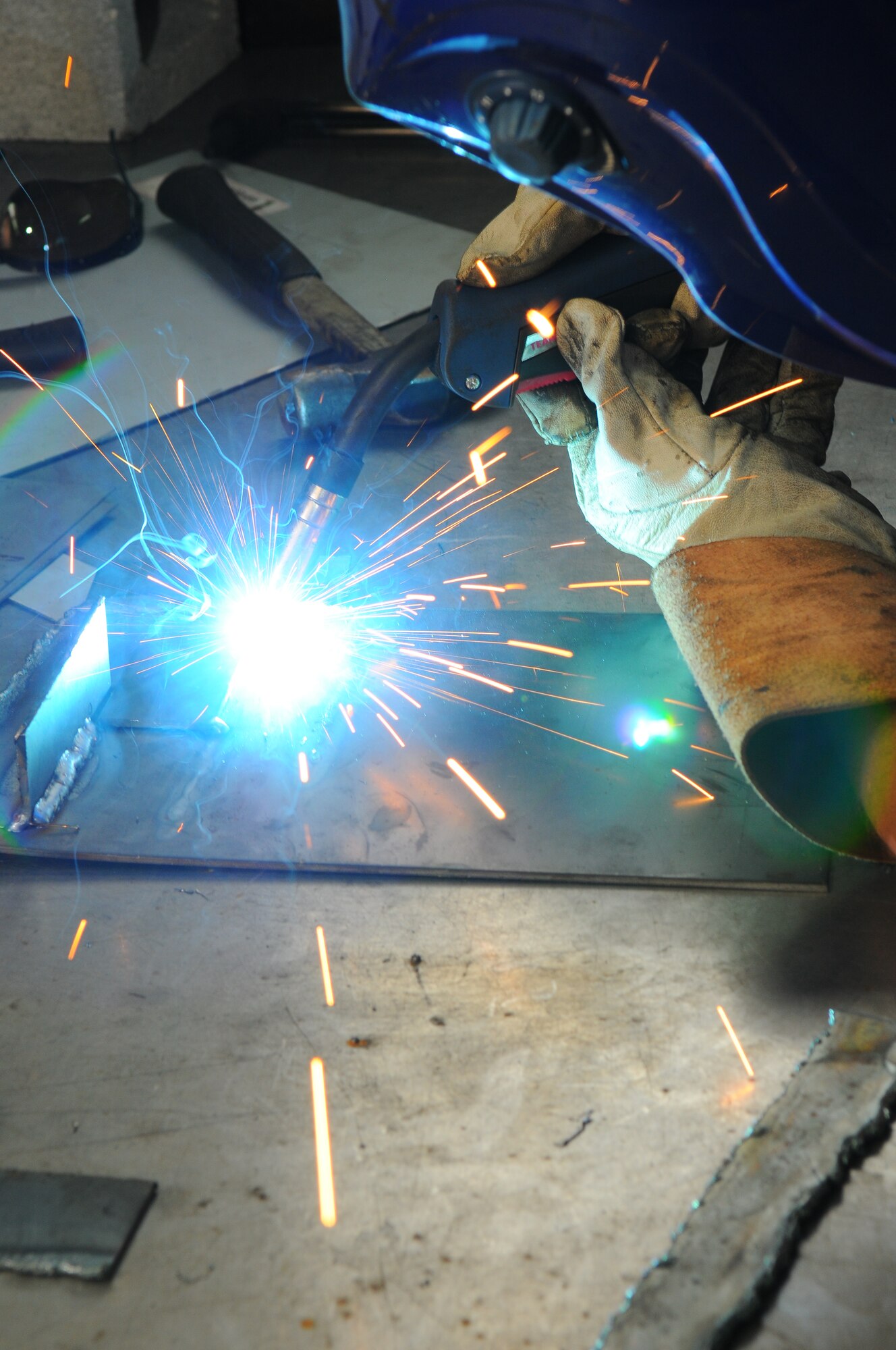 SPANGDAHLEM AIR BASE, Germany – Max Baer, 52nd Force Support Squadron, demonstrates how to weld using a metal inert gas welder at the auto skills center here June 8. Welding classes are offered monthly at Spangdahlem’s auto skills center. (U.S. Air Force photo/Airman 1st Class Dillon Davis)