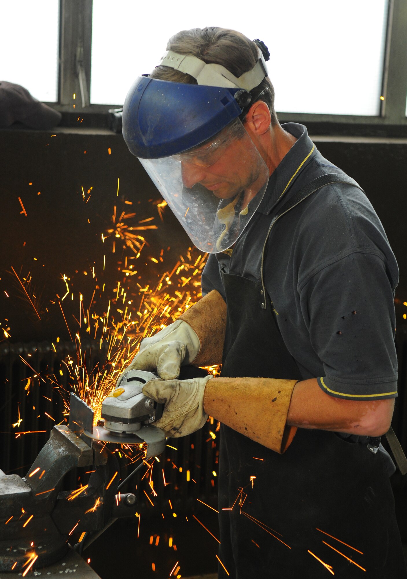 SPANGDAHLEM AIR BASE, Germany – Max Baer, 52nd Force Support Squadron civilian contractor, cuts a piece of scrap metal for welding training at the auto skills center here June 8. Welding classes are offered monthly at Spangdahlem’s Auto Hobby Shop. (U.S. Air Force photo/Airman 1st Class Dillon Davis)