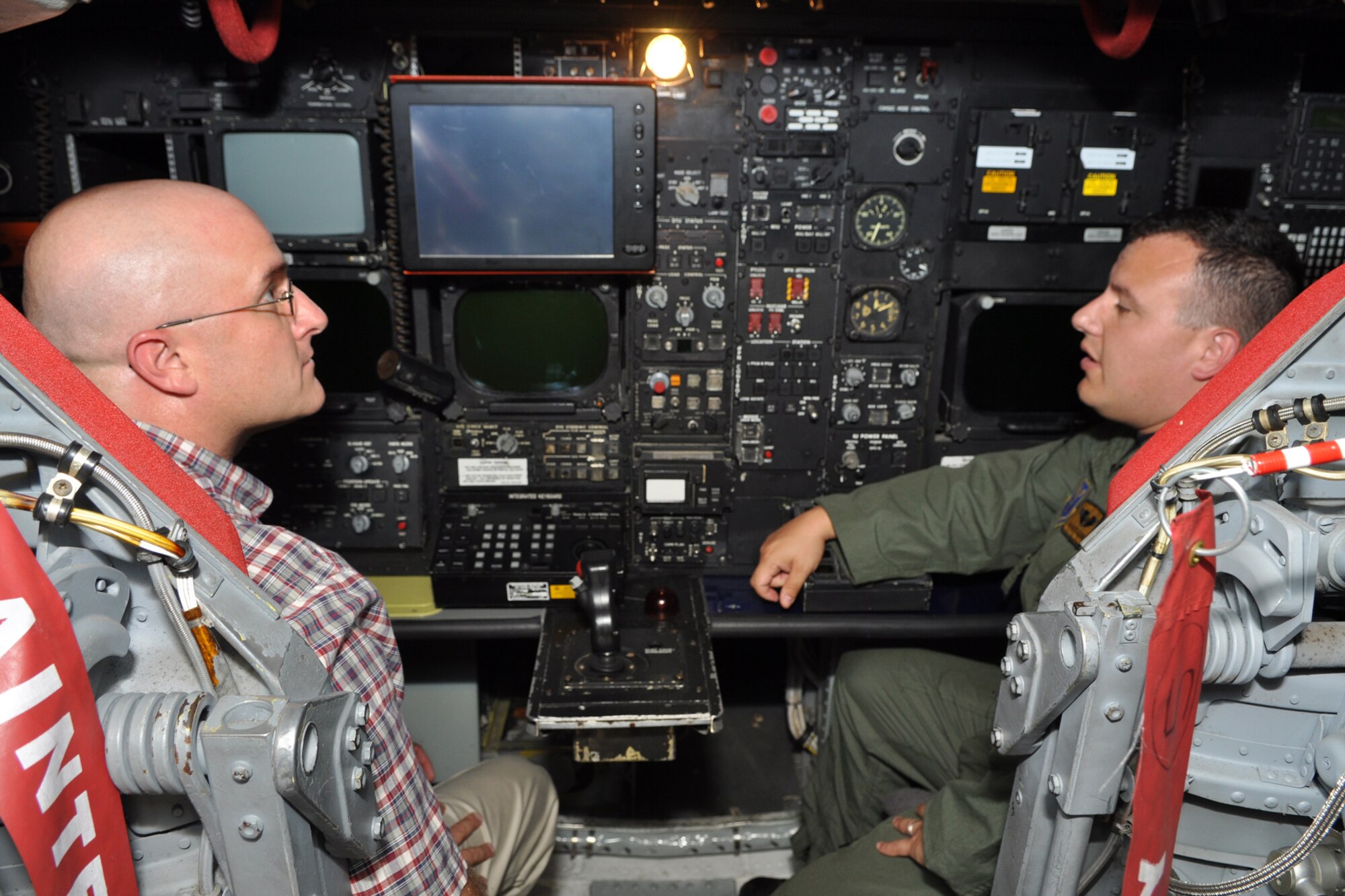 Thomas P. Gros, board member, Texas Wounded Warrior, gets a briefing about electronic warfare onboard a B-52H Stratofortress at Barksdale Air Force Base, La., from Capt. Patrick Godinez, electronic warfare officer, 11th Bomb Squadron, May 24, 2011. Captain Godinez is a Regular Air Force servicemember assigned to the 11th Bomb Squadron at Barksdale. He works side-by-side with some of the Reservists assigned to the 307th Bomb Wing at the base. Texas Wounded Warrior, an organization founded by golfers, makes it part of its mission to honor, and to empower our Wounded Warriors by providing them a weekend of fun, fellowship and entertainment on the golf course. (U.S. Air Force photo/Tech. Sgt. Jeff Walston)