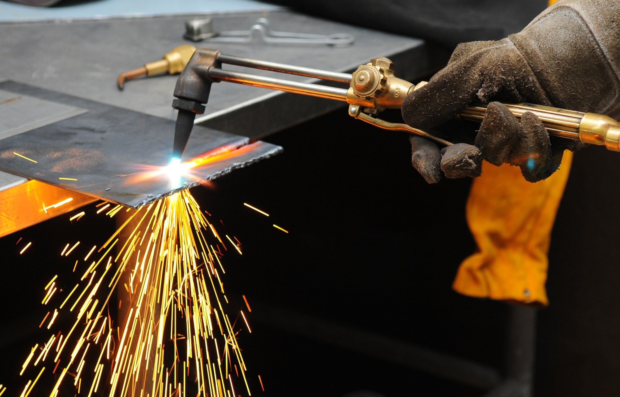 SPANGDAHLEM AIR BASE, Germany – A student uses an oxygen and acetylene cutting torch to cut through a piece of metal during a welding safety class at the auto skills center here June 8. Welding classes are offered monthly at Spangdahlem’s auto skills center. (U.S. Air Force photo/Airman 1st Class Dillon Davis)