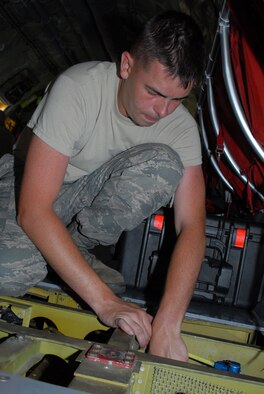 Airman 1st Class David Bryant, an Electrical Journeyman with the Electrical
and Environmental shop, replaces one of the overflow valves on a KC-135R
Stratotanker at Scott AFB, Ill. on June 6, 2011. Airman First Class Bryant
is assigned to the 906th Air Refueling Squadron which is associated with the
126th Air Refueling Wing, Illinois Air National Guard. (U.S. Air Force photo
by Airman 1st Class Dustin Clary)