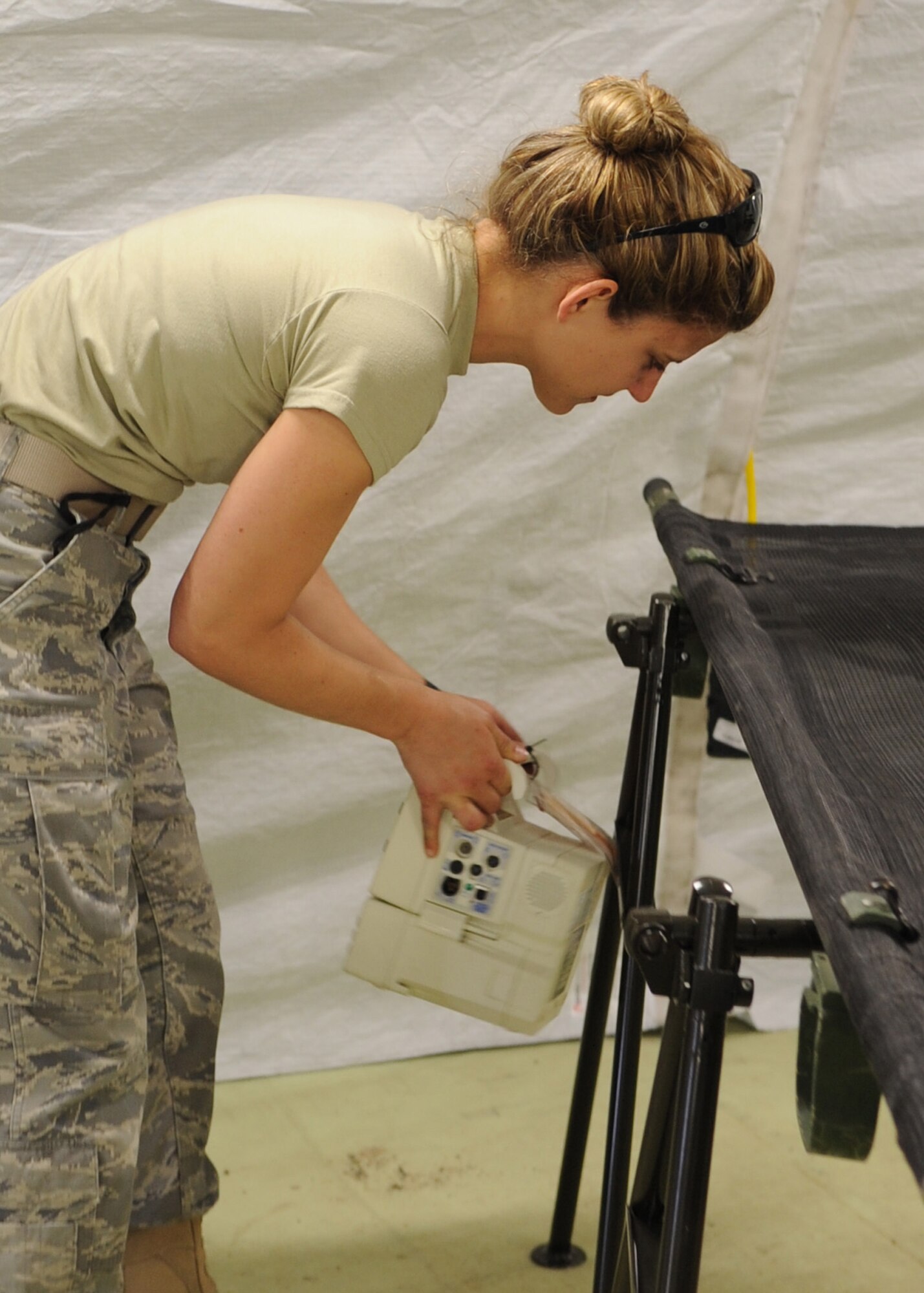 Capt. Kelsey Sweeny, 86th Medical Group from Ramstein Air Base, Germany, outfits a field hospital patient bed with all the necessary medical equipment in preparation for the hands-on portion of Medical Training Exercise in Central and Eastern Europe 2011 June 8. An annual Chairman of the Joint Chiefs of Staff-sponsored regional and multilateral exercise, MEDCEUR is designed to provide medical training and operational experience in a deployed environment for U.S. and partner nations. The countries participating in this year?s MEDCEUR are Macedonia, Montenegro, Bosnia and Herzegovina, Serbia, Slovenia and Norway.  The exercise will include both classroom and hands-on training and run until June 15. (U.S. Air Force photo/Staff Sgt. Nadine Y. Barclay)