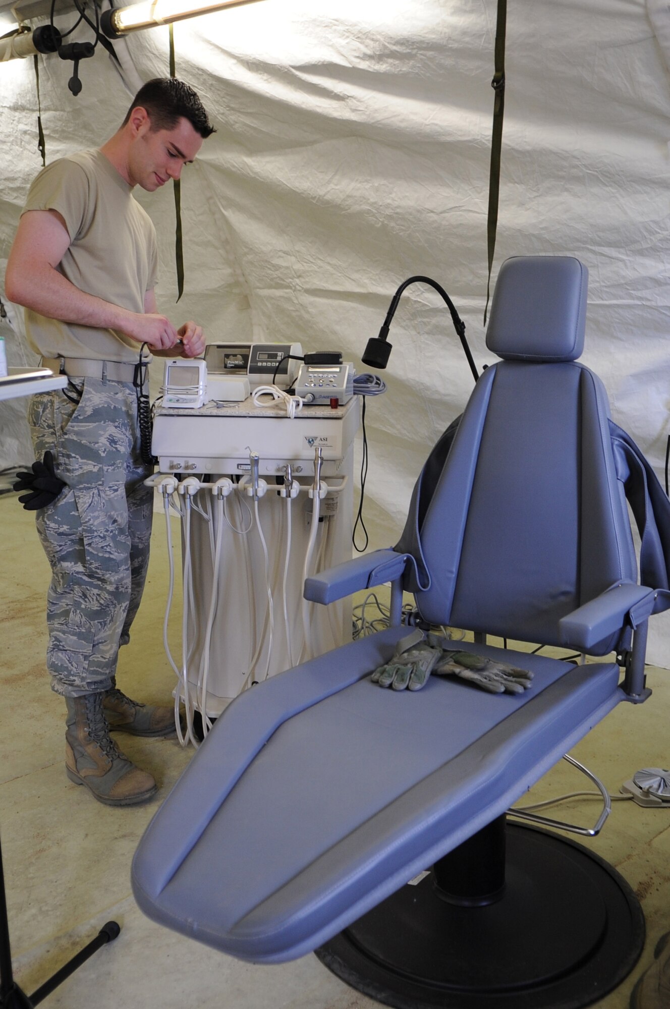 CAMP PEPELISHTE, Macedonia -- An Airman with U.S. Air Forces in Europe assembles a portable dental station into a field hospital in preparation for the hands-on portion of Medical Training Exercise in Central and Eastern Europe 2011 June 8. An annual Chairman of the Joint Chiefs of Staff-sponsored regional and multilateral exercise, MEDCEUR is designed to provide medical training and operational experience in a deployed environment for U.S. and partner nations. The countries participating in this year?s MEDCEUR are Macedonia, Montenegro, Bosnia and Herzegovina, Serbia, Slovenia and Norway.  The exercise will include both classroom and hands-on training and run until June 15. (U.S. Air Force photo/Staff Sgt. Nadine Y. Barclay)