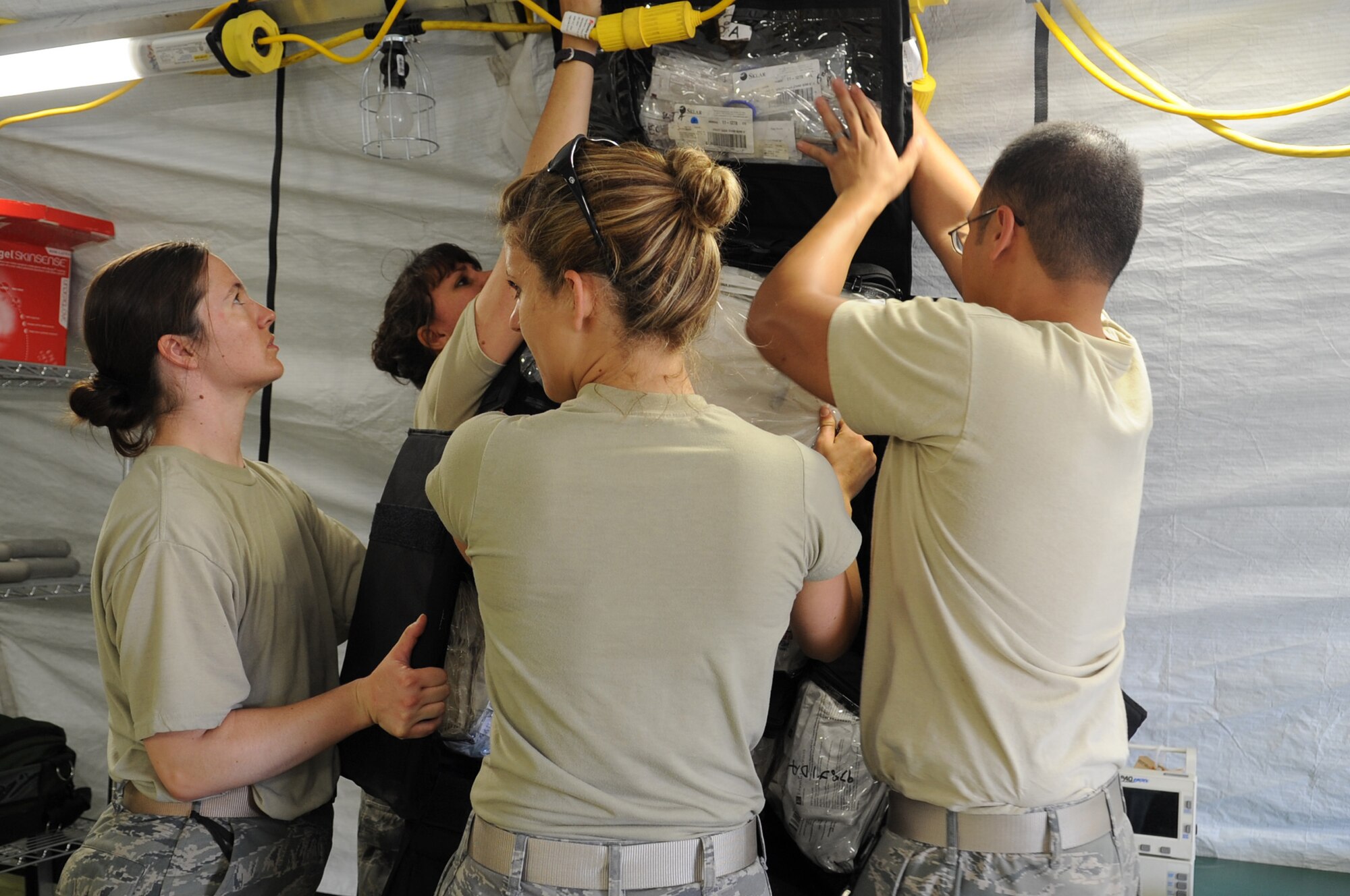 CAMP PEPELISHTE, Macedonia -- Medical Airmen from U.S. Air Forces in Europe unpack and organize medical supplies into  a field hospital in preparation for the hands-on portion of Medical Training Exercise in Central and Eastern Europe 2011 June 8. An annual Chairman of the Joint Chiefs of Staff-sponsored regional and multilateral exercise, MEDCEUR is designed to provide medical training and operational experience in a deployed environment for U.S. and partner nations. The countries participating in this year?s MEDCEUR are Macedonia, Montenegro, Bosnia and Herzegovina, Serbia, Slovenia and Norway.  The exercise will include both classroom and hands-on training and run until June 15. (U.S. Air Force photo/Staff Sgt. Nadine Y. Barclay)