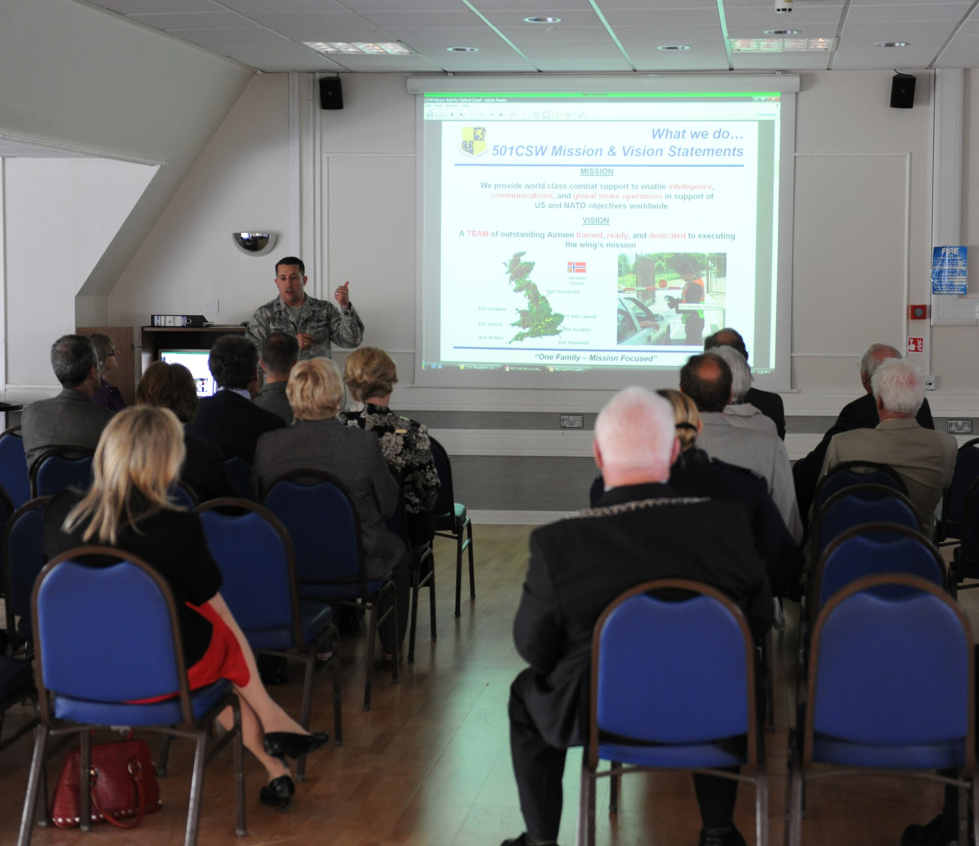 Col. Brian Kelly, 501st Combat Support Wing commander, explains the mission of the 501st CSW to local civic leaders during the RAF Fairford Civic Leaders Tour June 8. The civic leaders received briefings about the 501st CSW and 420th Air Base Squadron, as well as touring aircraft present for RIAT Media Day. (U.S. Air Force photo/1st Lt. Brian Maguire)