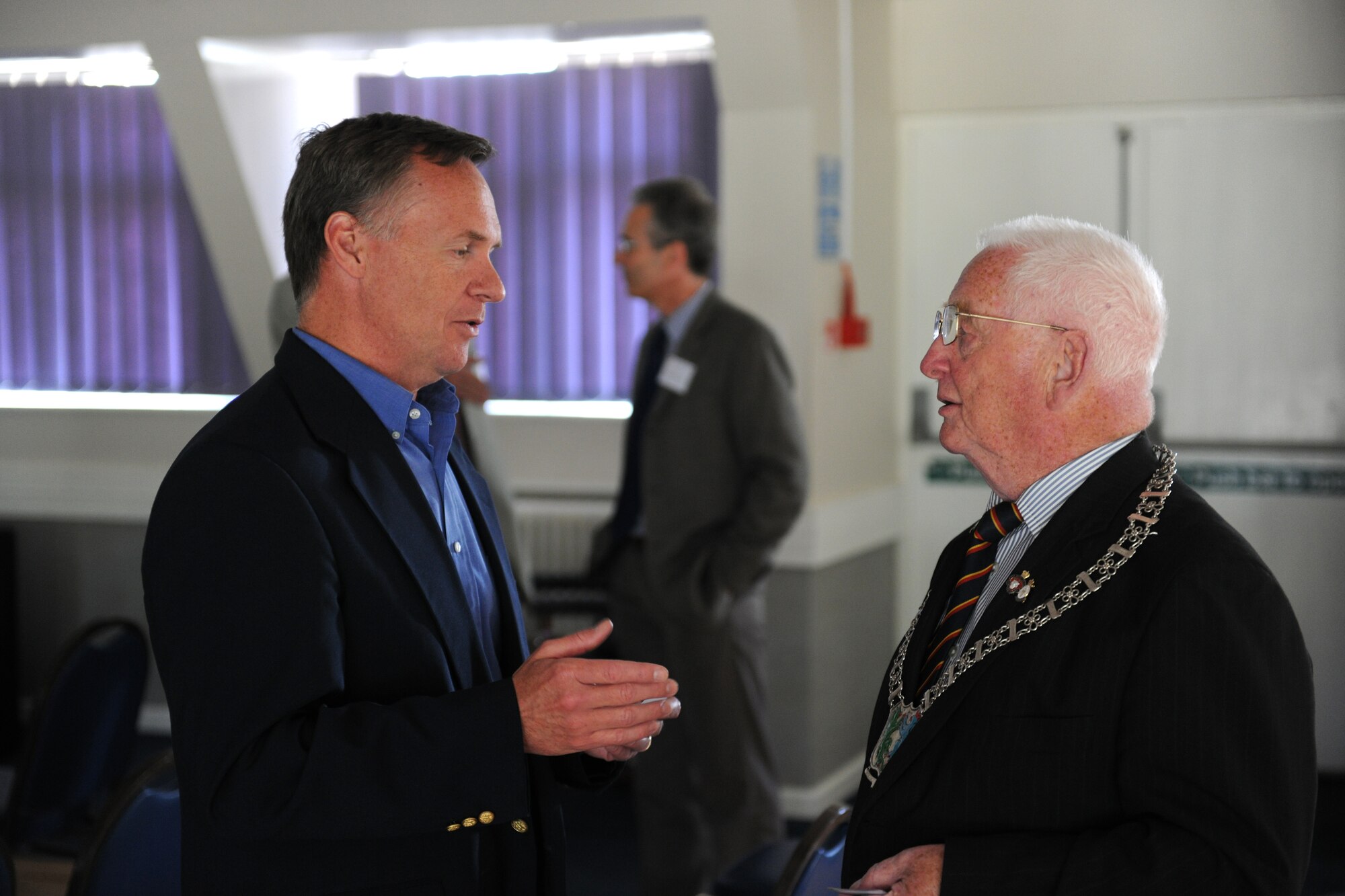 (At Left) Tim Hershberger, 420th Air Base Squadron site director, speaks with Cllr Rob Winney, Fairford Town Mayor, during the RAF Fairford Civic Leaders Tour June 8. Councillor Winney spoke about seeing RAF Fairford before construction began on the airfield during the Second World War. (U.S. Air Force photo/1st Lt. Brian Maguire)