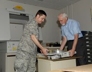 HANSCOM AIR FORCE BASE, Mass. - Dr. Steven Mittleman (right), deputy chief of the Electromagnetics Technology Division and 25-year veteran of the Sensors Directorate packs up equipment with Maj. Todd Beard June 7. The Air Force Research Laboratory will conduct an inactivation ceremony marking the end of operations of AFRL at Hanscom June 15. Research in the areas of electromagnetics and space physics has been conducted at Hanscom since 1945. (U.S. Air Force photo by Linda LaBonte Britt)