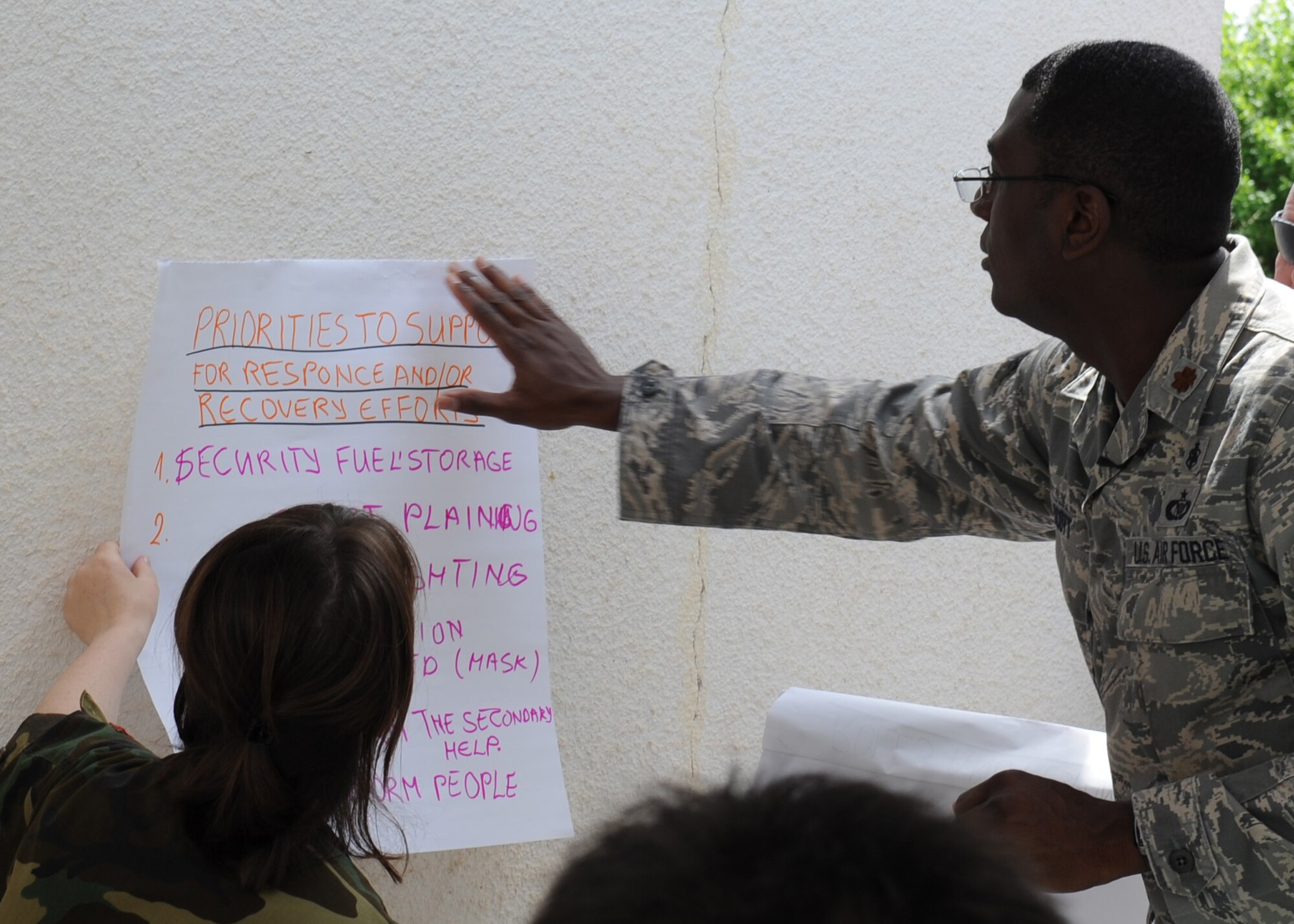 CAMP PEPELISHTE, Macedonia – Maj. Alvin Scott, U.S. Northern Command liaison officer to U.S. Transportation Command Surgeon General and a Defense Institute for Medical Operations instructor, teaches students from multinational partners about priorities to supply for a simulated response and recovery effort June 8 . This was part of the 2011 Medical Training Exercise in Central and Eastern Europe, or MEDCEUR 11, an annual, Chairman of the Joint Chiefs of Staff-sponsored regional and multilateral exercise, held in the spirit of NATO’s Partnership for Peace. Thirty-nine students from Macedonia, Slovenia, Serbia, Bosnia and Herzegovina, and Montenegro attended the course. (U.S. Air Force photo/Staff Sgt. Nadine Barclay)