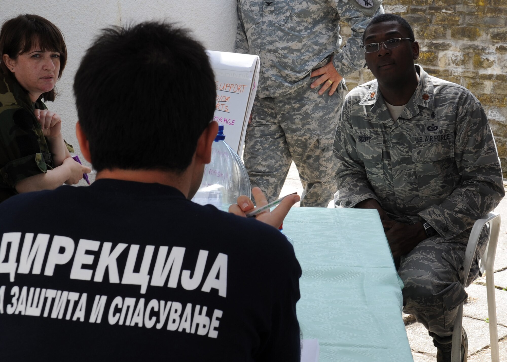 CAMP PEPELISHTE, Macedonia – Maj. Alvin Scott, U.S. Northern Command liaison officer to U.S. Transportation Command Surgeon General and a Defense Institute for Medical Operations instructor, teaches students from multinational partners about priorities to supply for a simulated response and recovery effort June 8 . This was part of the 2011 Medical Training Exercise in Central and Eastern Europe, or MEDCEUR 11, an annual, Chairman of the Joint Chiefs of Staff-sponsored regional and multilateral exercise, held in the spirit of NATO’s Partnership for Peace. Thirty-nine students from Macedonia, Slovenia, Serbia, Bosnia and Herzegovina, and Montenegro attended the course. (U.S. Air Force photo/Staff Sgt. Nadine Barclay)