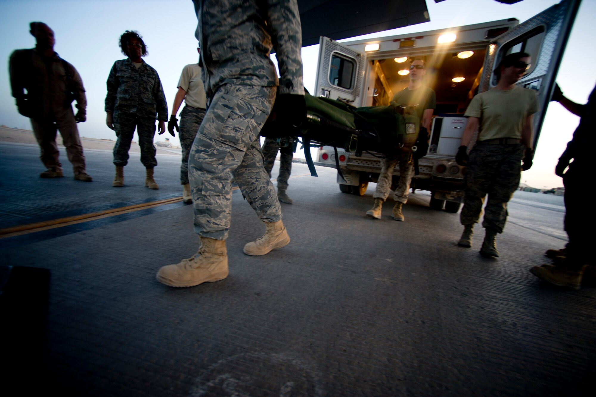 Members from the 451st Expeditionary Aeromedical Evacuation Squadron Detachment 1 Contingency Aeromedical Staging Facility load an medical equipment onto a C-130 Hercules at Camp Bastion, Afghanistan. The CASF team is responsible for taking care of and transporting patients from the staging facility and role hospital to aircraft who are then transported to the next level of medical care. (U.S. Air Force photo by Master Sgt. Adrian Cadiz)