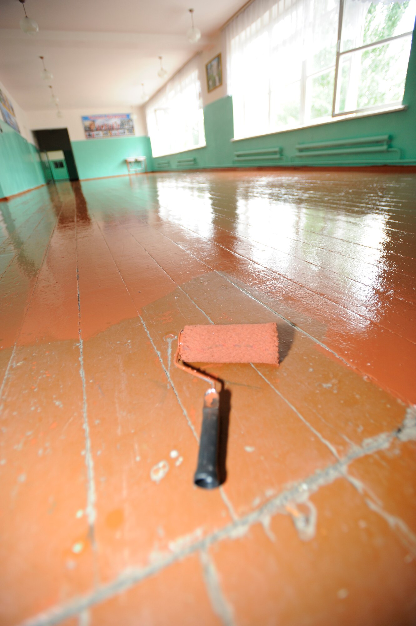 NIZNE-CHUISK VILLAGE, Kyrgyzstan -- Manas Area Benefit Outreach Society volunteers showcase their handiwork during a a break June 7.  MABOS representatives from the Transit Center at Manas visited the "Niz Village" June 7 to help school officials prepare for the upcoming school year.   (U.S. Air Force photo by Master Sgt. Jerome C. Baysmore)