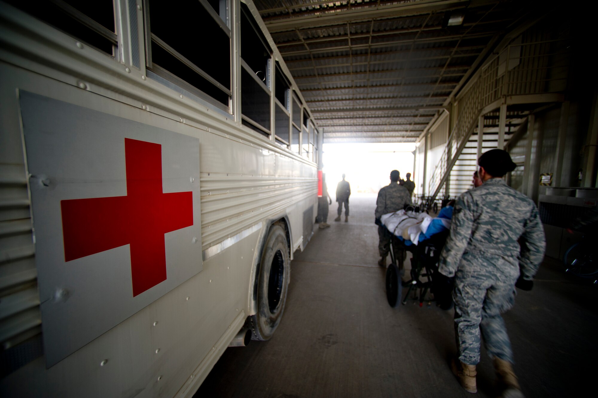Contingency Aeromedical Staging Facility load a wounded Marine onto an ambulance at Camp Bastion, Afghanistan. The CASF team is responsible for taking care of and transporting patients from the staging facility and role hospital to aircraft who are then transported to the next level of medical care. (U.S. Air Force photo by Master Sgt. Adrian Cadiz)