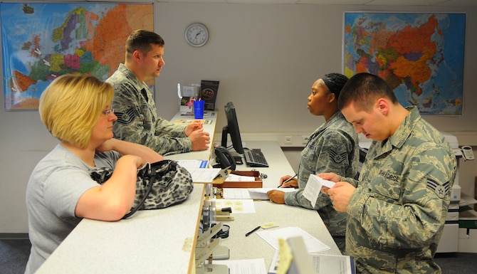 SPANGDAHLEM AIR BASE, Germany –Airmen from the 52nd Force Support Squadron help members and dependents get ration cards and travel vouchers amended at the Military Personnel Section’s First Stop here June 6. First Stop is the initial inprocessing center where Airmen and dependants acquire the necessary documents and information to live and work at their new duty station. (U.S.  Air Force photo/Airman 1st Class Dillon Davis)