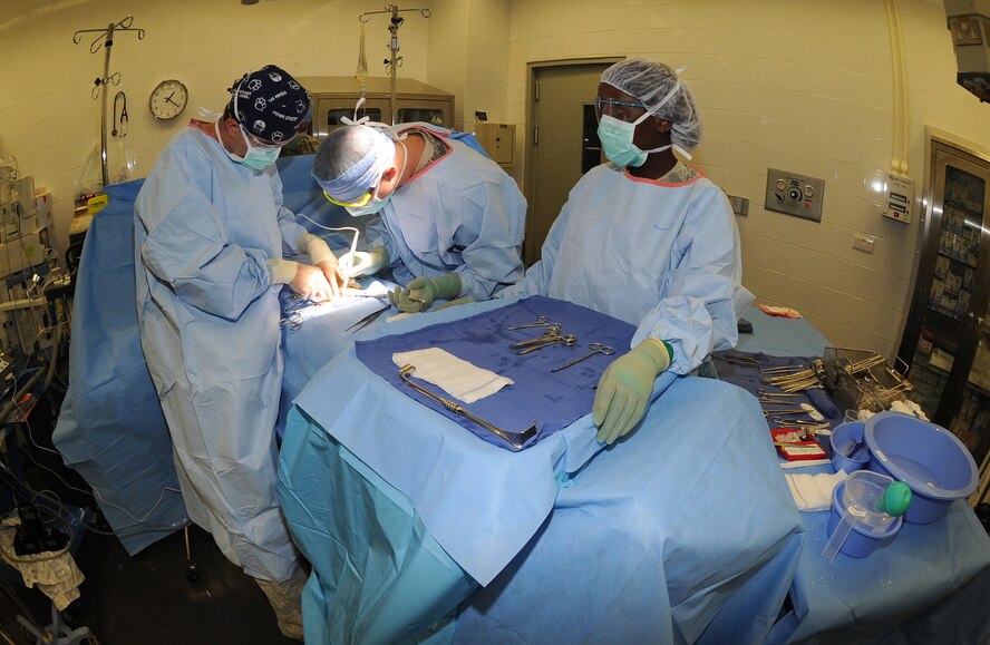 A surgical team with the 379th Expeditionary Medical Group performs an inguinal hernia repair surgery at an undisclosed location in Southwest Asia, May 31. The 379th Expeditionary Medical Group features a mobile forward surgical team which stands ready to respond to contingencies. When not forward deployed, the team performs routine procedures which allow deployed servicemembers to stay in theater for care and recovery. (U.S. Air Force photo/Staff Sgt. Liliana Moreno)     