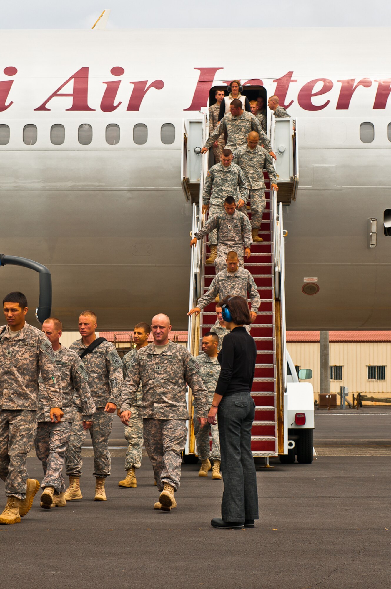 Members of the 2nd Brigade Combat Team, 82nd Airborne Division, leave a DC-10 after landing at Lajes Field, Azores, May 28 2011.  Members of the team were headed to Iraq in support of Operation New Dawn.  (U.S. Air Force Photo/Lucas Silva)