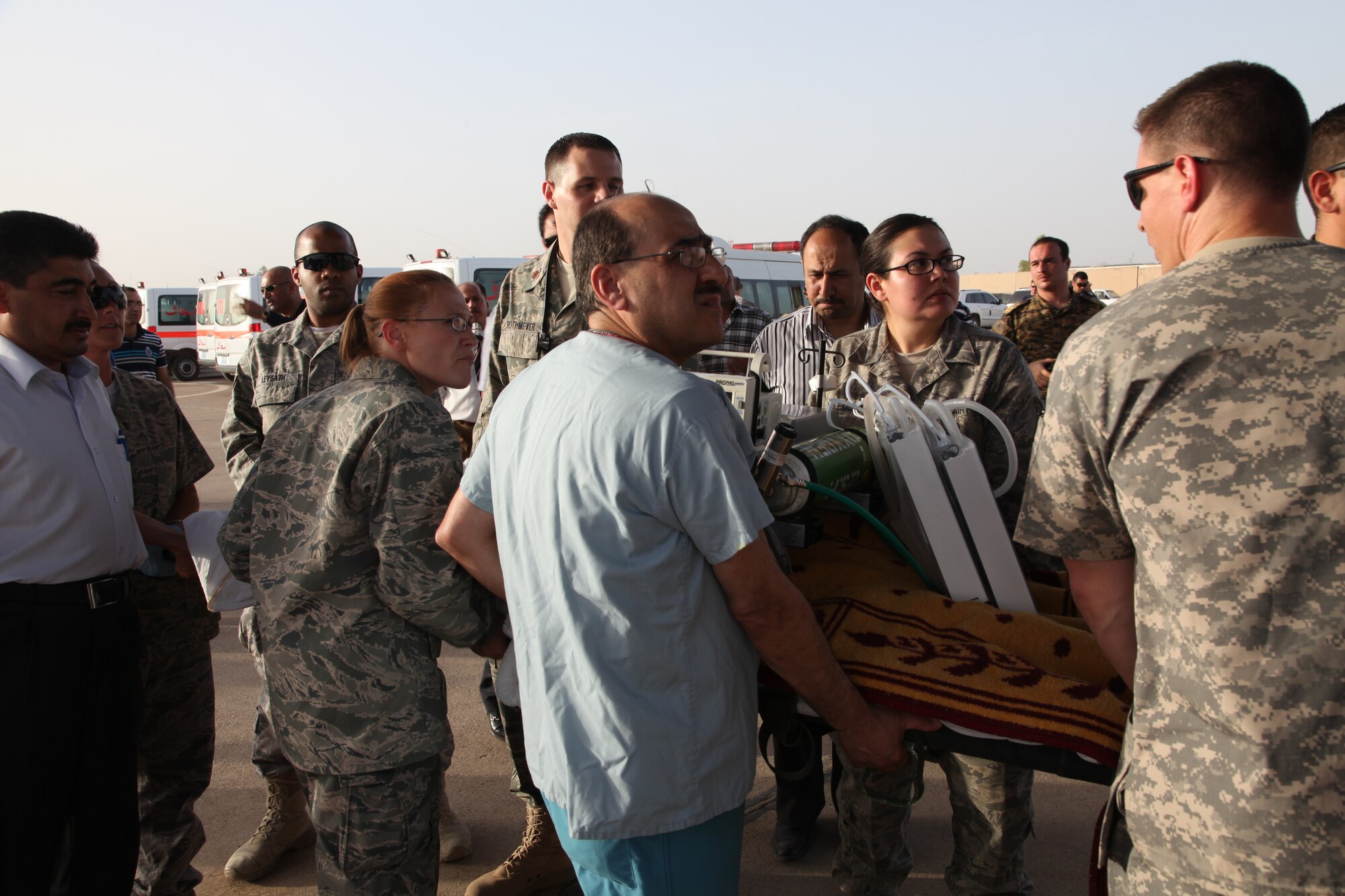 KIRKUK REGIONAL AIR BASE, Iraq – A medical crew with the 321st Expeditionary Medical Squadron loads a patient onto a Turkish C-130 May 20 after he was deemed stable enough for travel. Reports indicate 20 people were killed and nearly 80 people were injured when improvised explosive devices detonated near the police station in Kirkuk. The 321st EMEDS volunteered to help care for the wounded when civilian facilities were overwhelmed. (Courtesy photo)