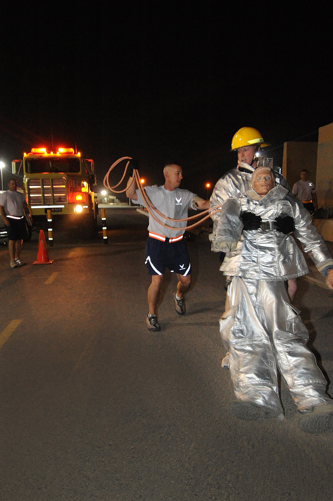 Deployed Airmen with the 386th Air Expeditionary Wing compete in the Rock Firefighter Challenge as part of Rock Fest IV. The challenge featured multiple events, including tool carry, equipment hoist, dummy carry, hose advance, tire strike and hose pack carry. (U.S. Air Force photo by Senior Airman Cynthia Spalding)