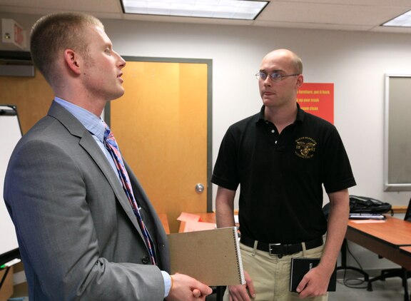 An employee at SAIC, gives a Marine advice about his future during a Transition Assistance Program workshop at Joint Base Myer-Henderson Hall, Va., June 9, 2011. Personalized guidance by the TAP staff is one focus of Commandant of the Marine Corps Gen. James F. Amos' planning guidance in order to better equip Marines for the transition to civilian life.