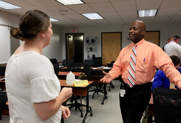 Michael Brinkley, a veteran's employment representative, talks with a military member about her options following her end of service date at a Transition Assistance Program workshop at Joint Base Myer-Henderson Hall, Va., June 9, 2011. This one-on-one interaction is one of Commandant of the Marine Corps Gen. James F. Amos' initiatives and helps Marines plan wisely for their future.