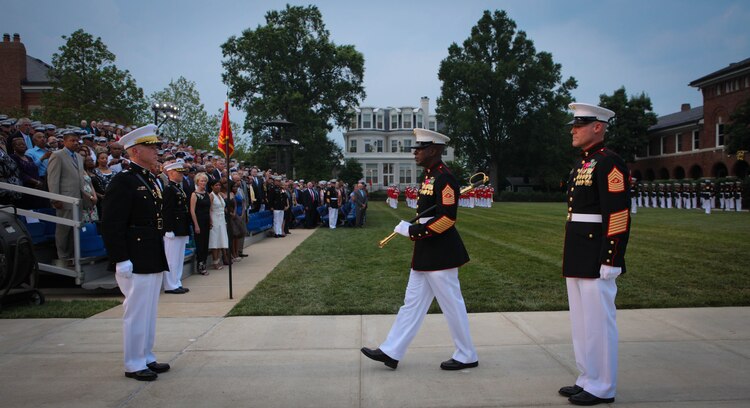 Sgt. Maj. of the Marine Corps Carlton W. Kent approaches Commandant of the Marine Corps Gen. James F. Amos to hand over the sword of office during a relief and appointment ceremony at Marine Barracks Washington June 9, 2011. The sword of office was then handed to Sgt. Maj. Micheal Barrett, newly appointed Sergeant Major of the Marine Corps. Barrett, an infantryman by trade, is the 17th Sergeant Major of the Marine Corps, a billet appointed by the Commandant to be his senior enlisted advisor.