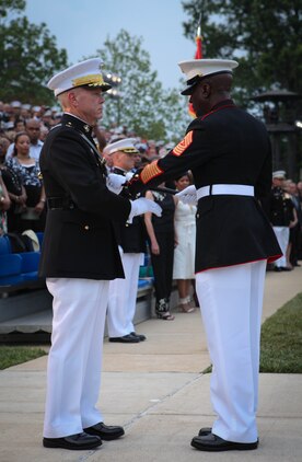Sgt. Maj. of the Marine Corps Carlton W. Kent hands the sword of office to Commandant of the Marine Corps Gen. James F. Amos, signifying the relinquishing of his duty as the Marine Corps senior enlisted advisor to the Commandant, during a relief and appoint ceremony at Marine Barracks Washington June 9, 2011. The sword of office was then handed to Sgt. Maj. Micheal Barrett, who is now the 17th Sergeant Major of the Marine Corps.