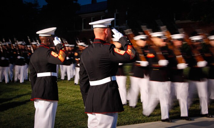Retired Sgt. Maj. of the Marine Corps Carlton W. Kent and newly appointed Sgt. Maj. of the Marine Corps Micheal Barrett salute during the pass-and-review portion of the relief and appointment ceremony June 9, 2011, at Marine Barracks Washington. Barrett, an infantryman by trade, is the 17th Sergeant Major of the Marine Corps, a billet appointed by the Commandant to be his senior enlisted advisor.
