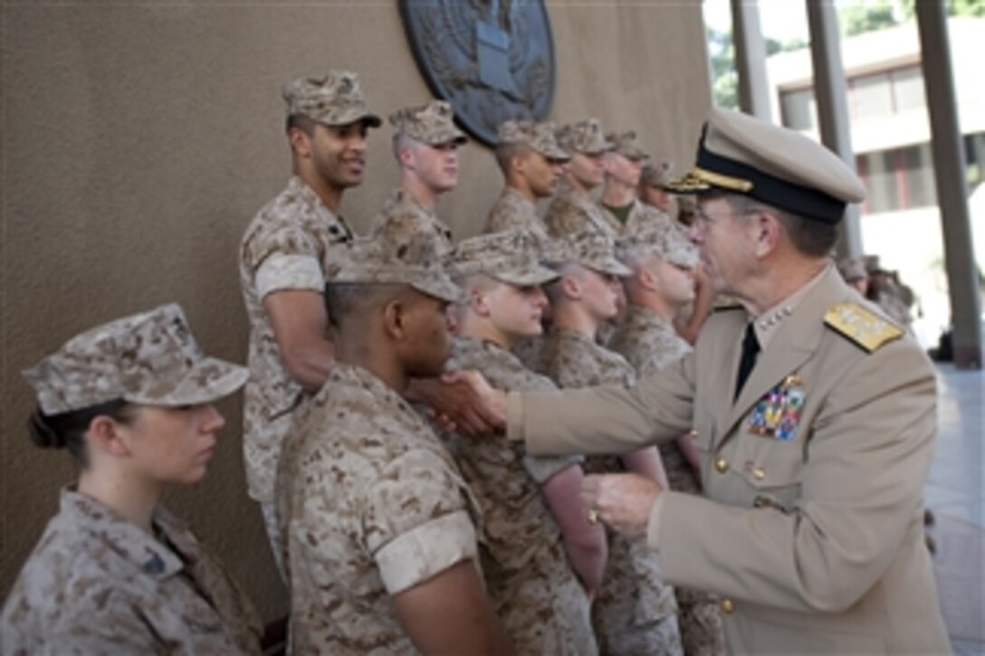 Chairman of the Joint Chiefs of Staff Adm. Mike Mullen greets U.S. Marines assigned to the embassy in Cairo, Egypt, on June 8, 2011.  Mullen is on a seven-day trip visiting Egypt and Europe to meet with counterparts and leaders.  