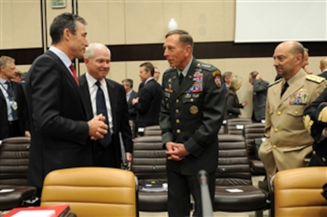 NATO Secretary General Anders Fogh Rasmussen (left), Secretary of Defense Robert M. Gates, ISAF Commander Gen. David Petraeus (2nd from right) and Supreme Allied Commander Europe speak just prior to the NATO and non-NATO ISAF contributing nations meeting during the NATO formal Defense Ministerial in Brussels, Belgium, on June 9, 2011.  