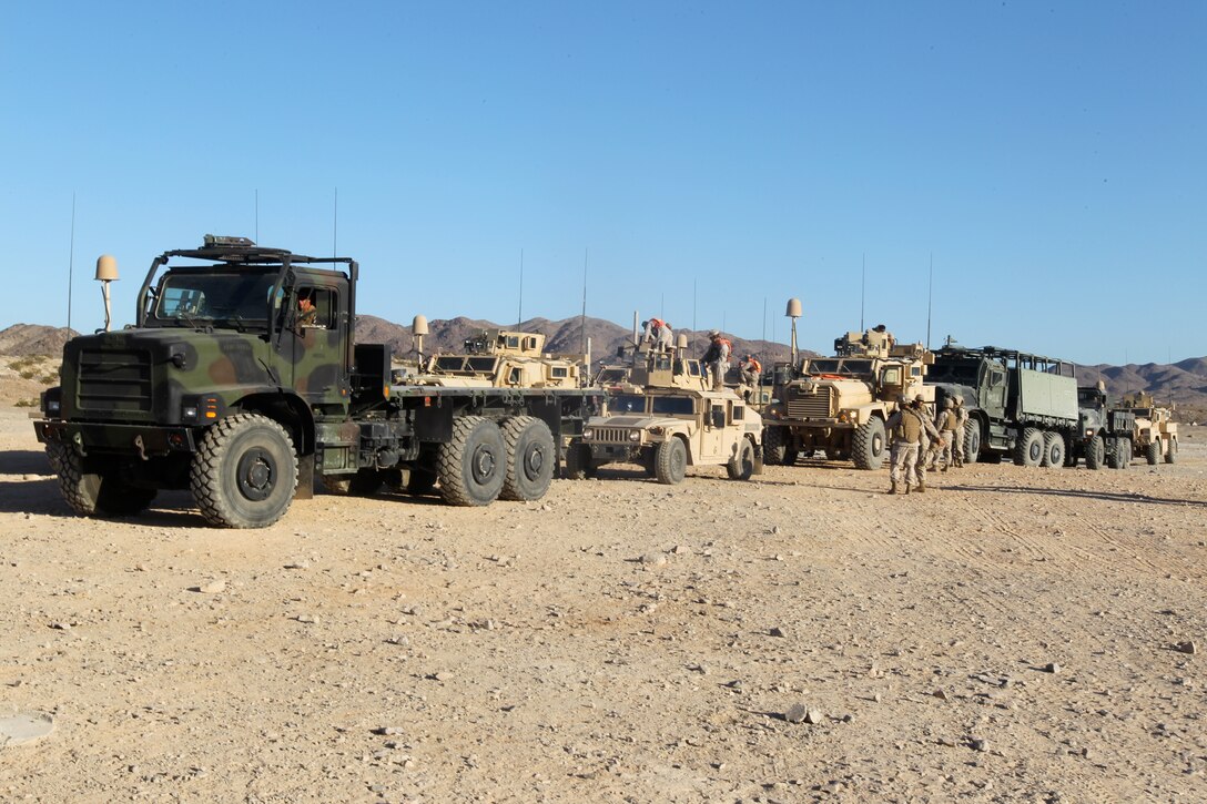 Vehicles with Motor Transportation Company, Marine Wing Support Squadron 371, are inspected one final time before the Enhanced Mojave Viper convoy training at Combat Center range 205 June 10, 2011.