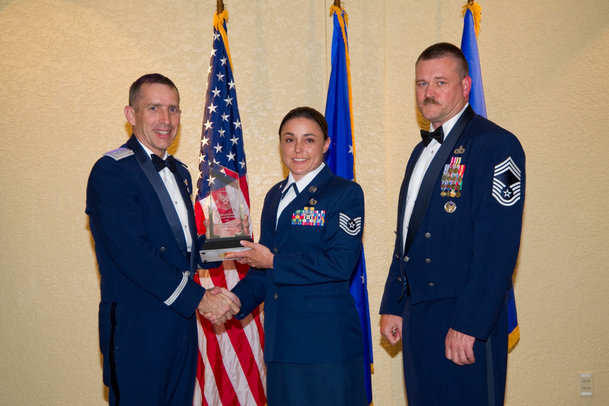 NELLIS AIR FORCE BASE, Nev. – Maj. Gen Bret Williams, U.S. Air Force deputy chief of staff for operations, plans and requirements and Chief Master Sgt. Michael Kossover, airfield management career field manager, present Tech. Sgt. Venus Applebury, 57th Operations Support Squadron deputy airfield manager, the award for 2010 U.S. Air Force Airfield Management NCO of the Year May 9, at the Air Force Airfield Operations Conference at Keesler Air Force Base, Miss. The American Association of Airport Executives also recently recognized Sergeant Venus Applebury during their annual meeting in Atlanta.