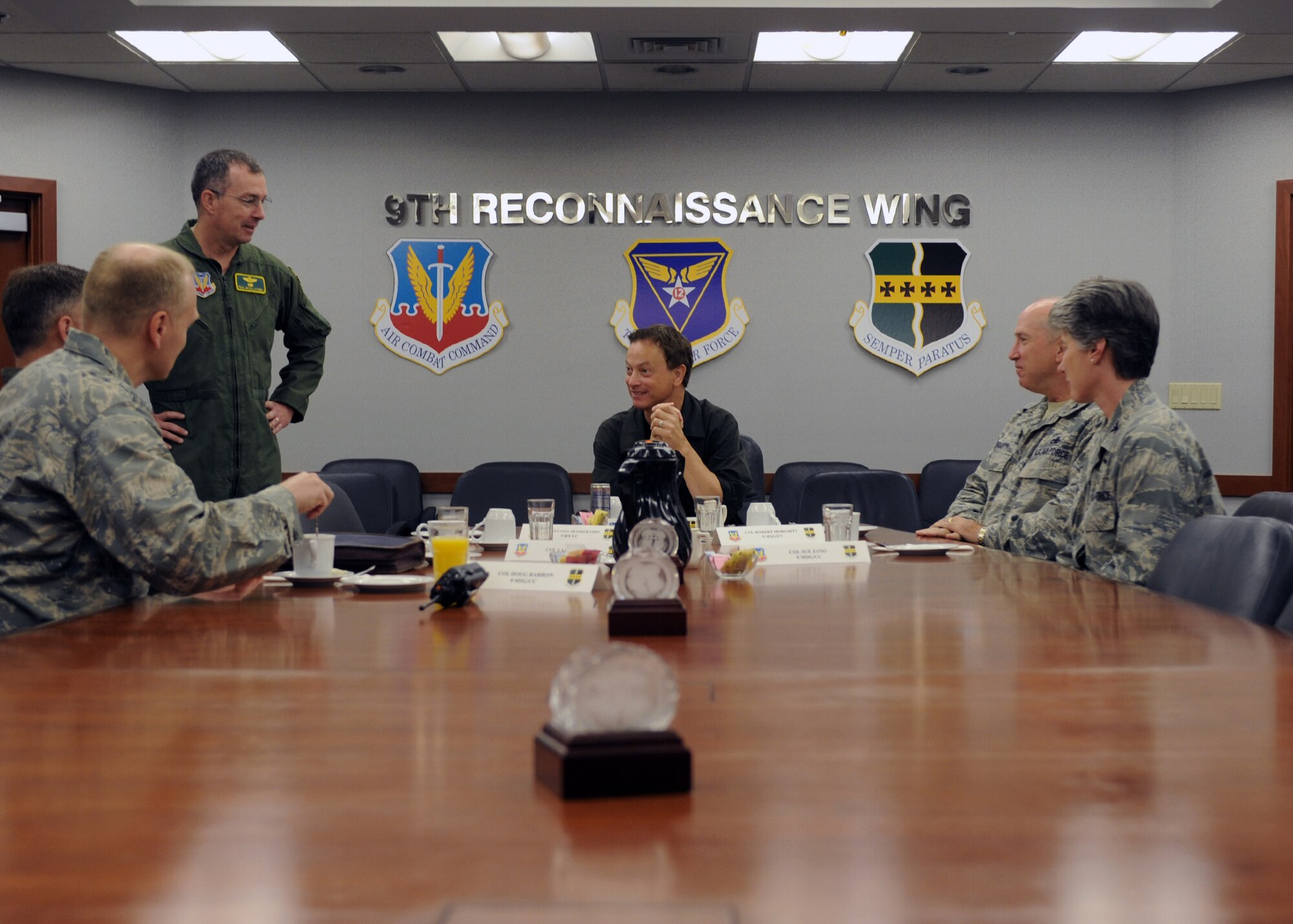 Gary Sinise receives a mission brief June 7, 2011, at Beale Air Force Base, Calif., prior to beginning training to take a high flight to 70,000 feet in a U-2 Dragon Lady. (U.S. Air Force photo/Sean Bhakta)