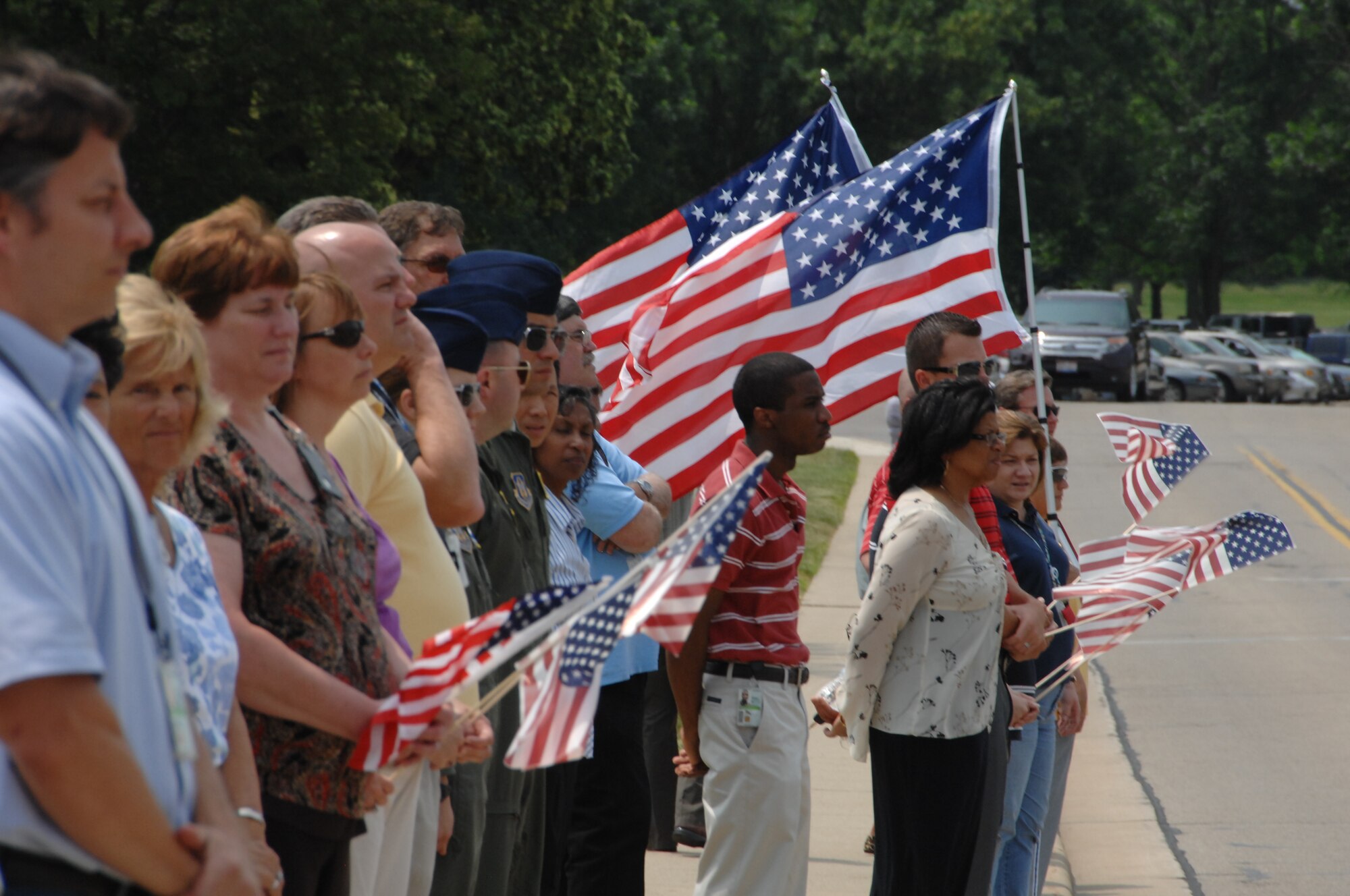 Wright-Patterson Air Force Base employees honor Marine Cpl. Paul W. Zanowick II of Miamisburg, Ohio during a ceremony at Wright-Patterson Air Force Base Thursday, June 9, 2011.Corporal Zanowick II died June 3 while conducting combat operations in Helmand province, Afghanistan. He was assigned to 3rd Battalion, 4th Marine Regiment, 1st Marine Division, I Marine Expeditionary Force, Twentynine Palms. (U.S. Air Force photo/Ben Strasser)