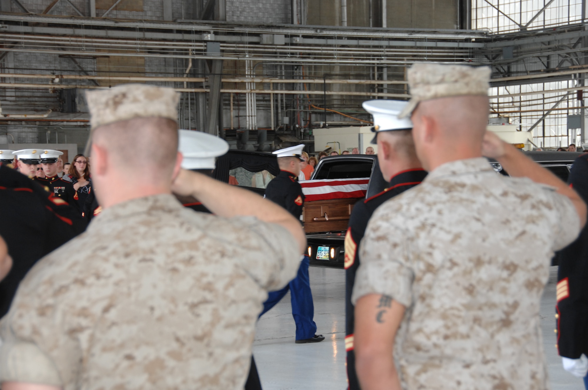 Airmen and Marines honor Marine Cpl. Paul W. Zanowick II of Miamisburg, Ohio during a ceremony at Wright-Patterson Air Force Base Thursday, June 9, 2011.Corporal Zanowick II died June 3 while conducting combat operations in Helmand province, Afghanistan. He was assigned to 3rd Battalion, 4th Marine Regiment, 1st Marine Division, I Marine Expeditionary Force, Twentynine Palms. (U.S. Air Force photo/Ben Strasser)